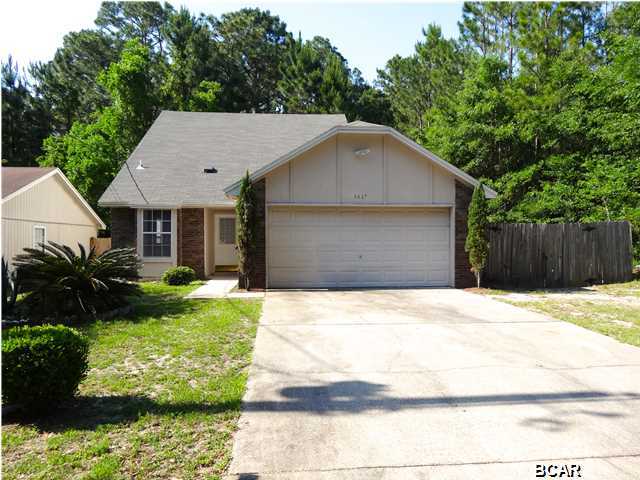 Convenient to Tyndall AFB, this charming home is located in a quiet family style neighborhood. The interior has beautiful fireplace in the living room, kitchen with breakfast bar, bedrooms located on the second floor and open loft that can be used as an office. Back yard has privacy fence plus the comfort of a 2 car garage. Property is just 2 blocks from the canal with access to the East Bay, so you can bring your boat or canoe and enjoy a little fishing. Age, Square Footage, and room sizes approx, if important please verify.