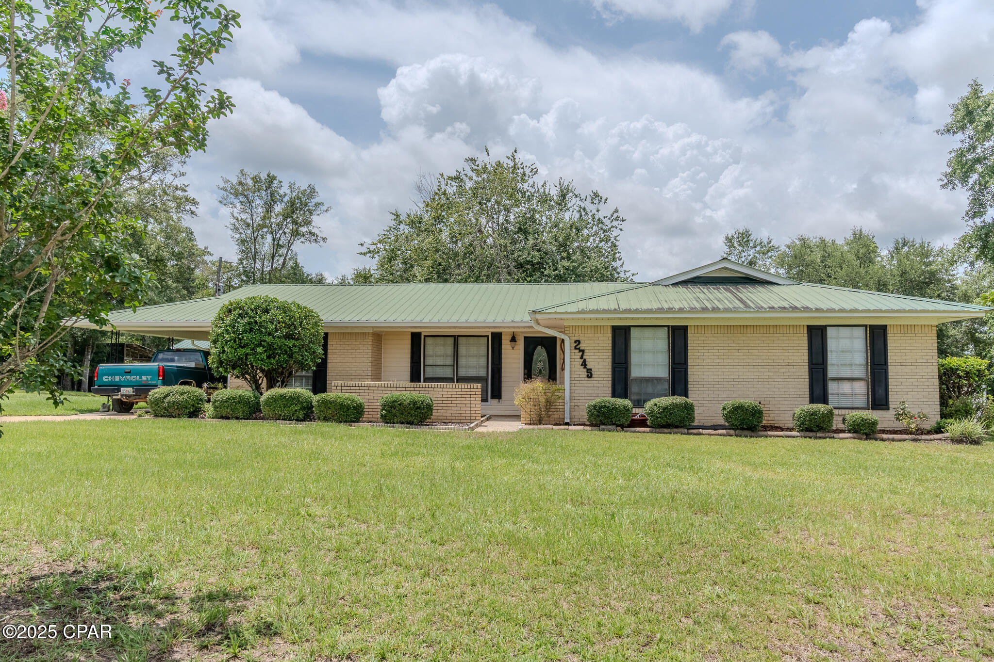 CURRENTLY UNDER CONTRACT, SELLER WILL CONSIDER BACKUP OFFERS. Imagine yourself surrounded by the tranquility of 3 acres in this well-maintained 3 bedroom, 2 bathroom brick home. This property offers more than just a residence; it's a lifestyle. Four outbuildings, three equipped with electricity and one featuring a convenient half-bath, present endless possibilities for workshops, studios, or storage.  Two of the outbuildings have air conditioners. Step inside to discover a beautifully remodeled kitchen complete with custom cabinets, a walk-in pantry, and indulge in the spa-like experience of the new bathrooms with their custom tile showers. The master suite offers a dream-come-true walk-in closet. New tile flooring in a large portion of the house. HVAC system was installed in 2023.  New septic system and drain fields.  Relax in the sunroom or entertain on the covered back patio. This is more than just a house; it's an opportunity to create your ideal country retreat. Some photos are virtually staged. Make an appointment to make it yours!