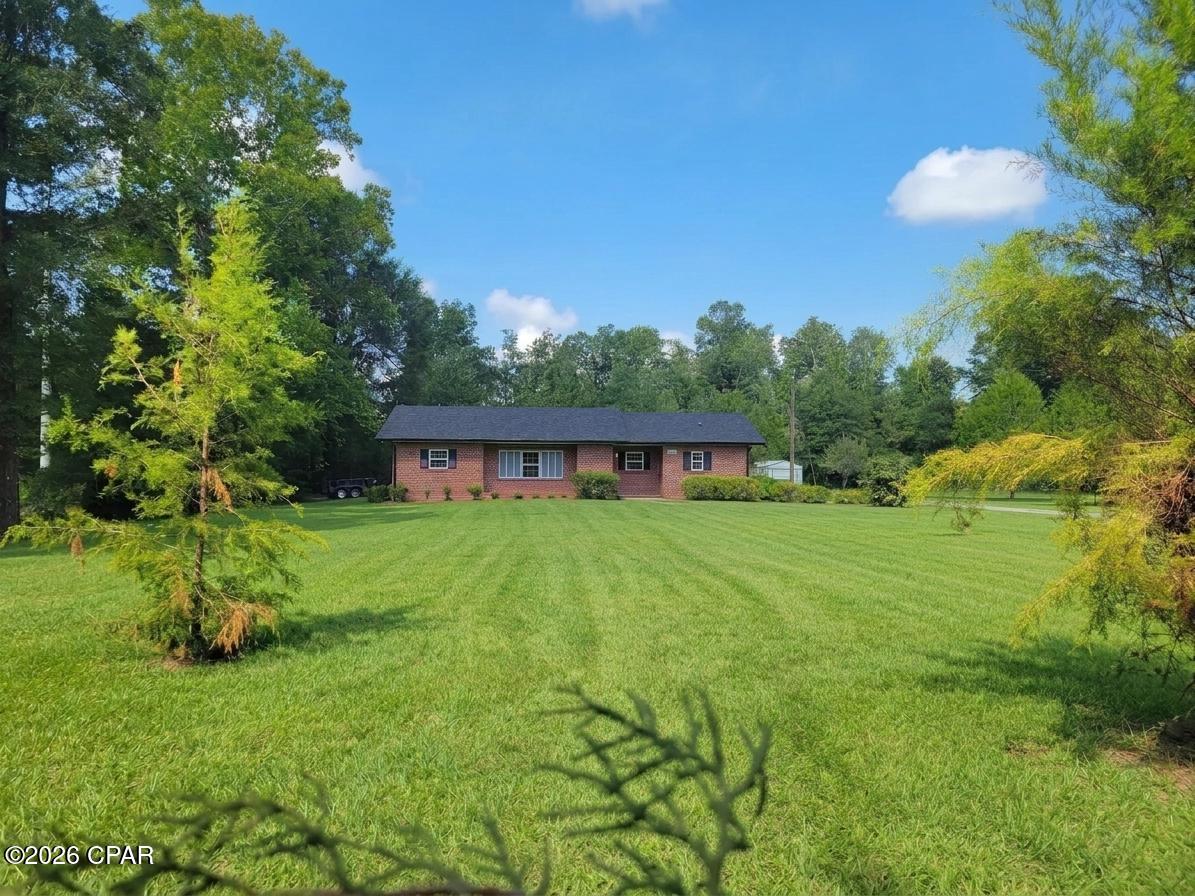 Welcome to this beautifully remodeled brick home situated on 2 peaceful acres in Marianna! Thoughtfully updated from top to bottom, this move-in-ready home offers the perfect combination of modern finishes, privacy, and convenience.

Step inside to a bright, open floor plan featuring LVP flooring throughout and a completely remodeled kitchen with beautiful quartz countertops, new cabinetry, and new appliances. The bathrooms have also been updated, including a gorgeous tiled shower that adds a fresh, modern touch.

Major improvements include a new roof, new gutters, new windows, new doors, duct work and a new water heater, giving the new owner peace of mind for years to come.

Tucked away in a secluded setting with 2 acres to enjoy, you'll have plenty of room for outdoor living, gardening, pets, or simply relaxing and enjoying the privacy. Despite the peaceful setting, you're only about 6 miles from the Marianna I-10 exit, where you'll find plenty of shopping, dining, and everyday conveniences. For those who enjoy the outdoors, beautiful Blue Springs is just 2.4 miles away.

With extensive renovations, acreage, privacy, and a convenient location, this property offers the best of country living while still being just minutes from everything Marianna has to offer!