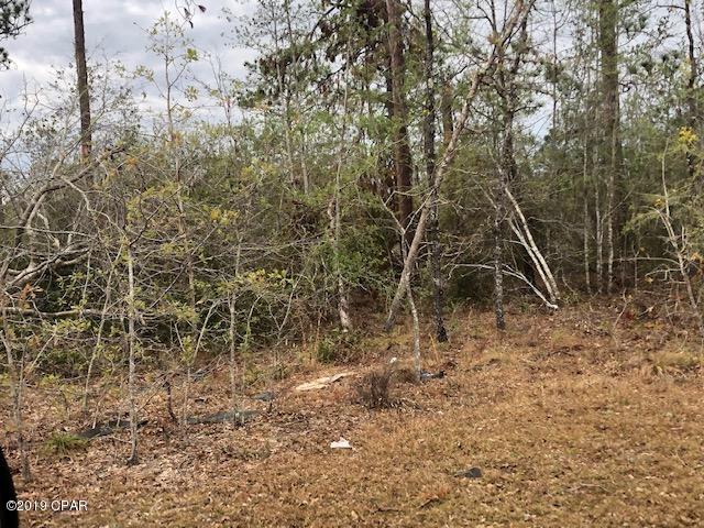 This is 8 acres of mixed wooded land  south of Marianna.  There is a mobile home on the property of no value.  There is a well and septic tank, condition unknown.   This is an opportunity for you to own a parcel of land to call your own!