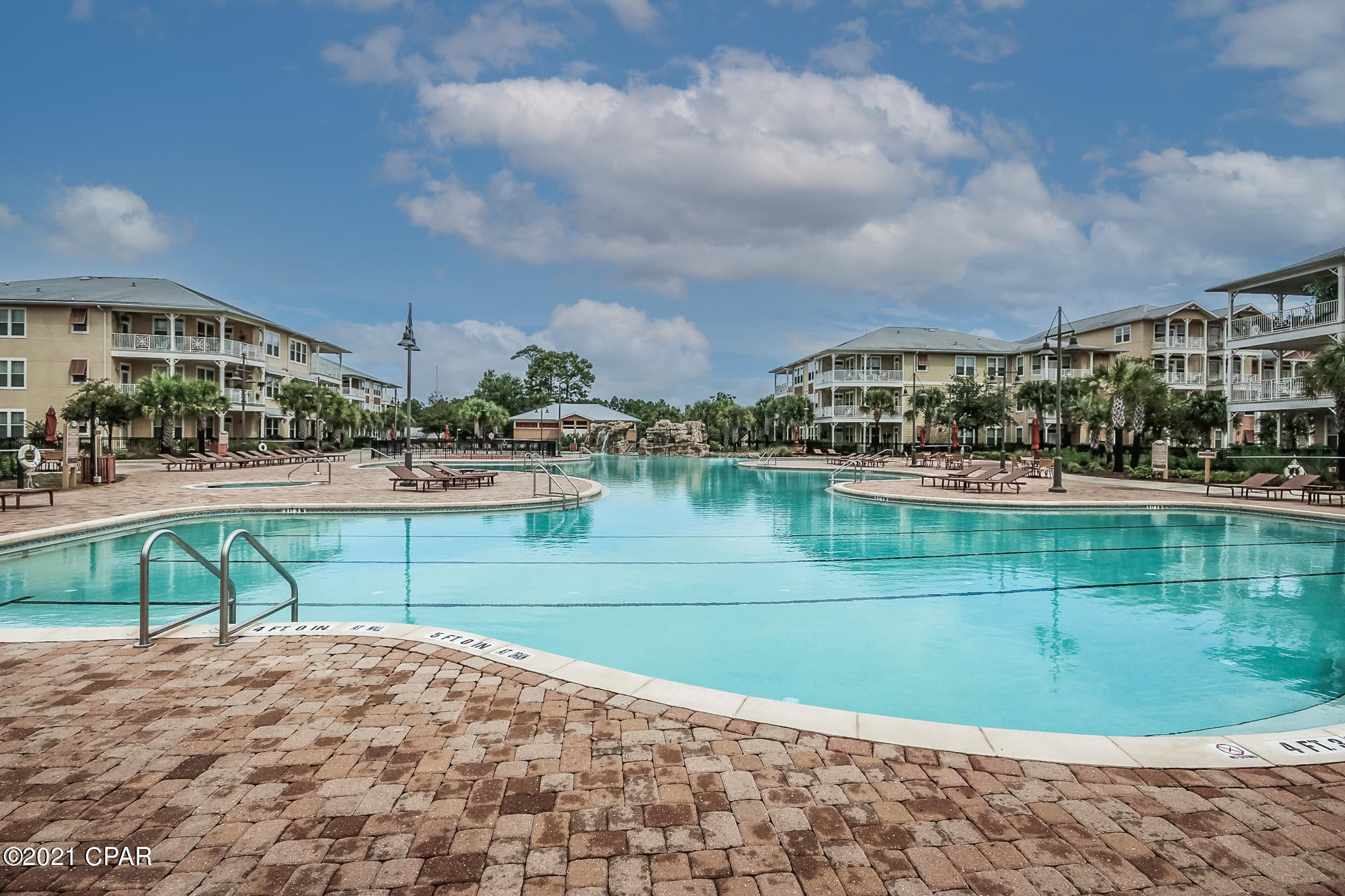 Splendid 2 bedroom unit in a resort style community on the third floor with garage parking on same level. The unit has 2 master suites and is located as close to parking as possible. This unit has stainless steel appliances, new LVP floors and granite counter tops. Large balcony that can be accessed from both bedrooms and living room.. Island Reserve is a gated community that has nice landscaping throughout the complex, and many amenities such as a resort style  pool with a waterfall, indoor basketball court, gym, hot tub, theater room, and covered parking. Take the elevator down to the pool or the other amenities. No short term rentals allowed. Seller has already paid the assessment. The community seen from the balcony is a 55+ and is very quiet.