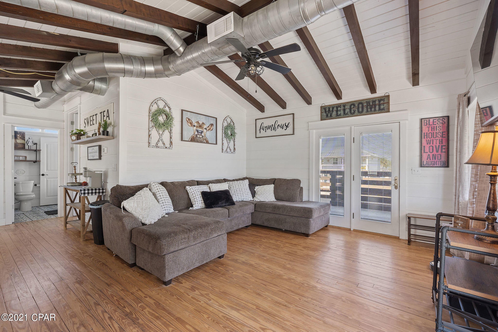 Stunning upstairs re-model makes this ultra modern farm style ranch a dream come true at the beach! With exposed beam vaulted ceilings, all new kitchen, windows, gigantic deck, a/c, roof, stairs, and bathroom, this home has so much character Mother Teresa could live here. The owners are finishing out the downstairs with the same high end finishes and features upstairs to deliver a turn-key, move-in ready home at closing. You have time to make this home a duplex with an acceptable negotiated offer! With ample room for a pool & outdoor oasis in the large back yard, this property is a cash cow as a vacation rental with projections at close to $60k / year as a duplex with pool. 2/1 upstairs & 2/1 downstairs. Furnishings negotiable.