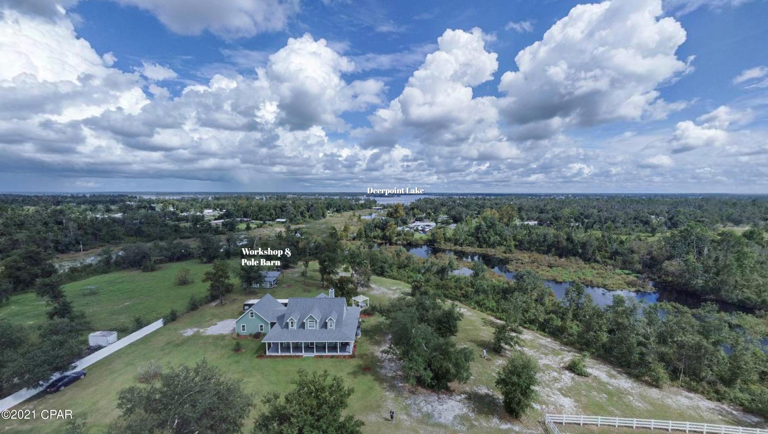 CURRENTLY UNDER CONTRACT, SELLER WILL CONSIDER BACKUP OFFERS. This is the perfect ''storybook'' home that you've been waiting for! Perfectly maintained 3 bedroom/2.5 bath custom home on 20 acres with a 4-stall horse barn, hay barn, workshop, pole barn, and access to fishing, kayaking or paddleboarding to Deer Point Lake. The home has all the upgrades you could ever want, including wraparound porch, new dual HVACs, new roof (2019), gorgeous hardwood floors, custom cabinets and countertops, oversized garage, and so much more! Heavy duty vinyl horse fence surrounds the pasture, paddocks and lighted arena. The horse barn also has many upgrades, including insulated roof and walls, rubber StableComfort floors, and a beautiful tack room with kitchenette. Flood zone X, flood insurance not required