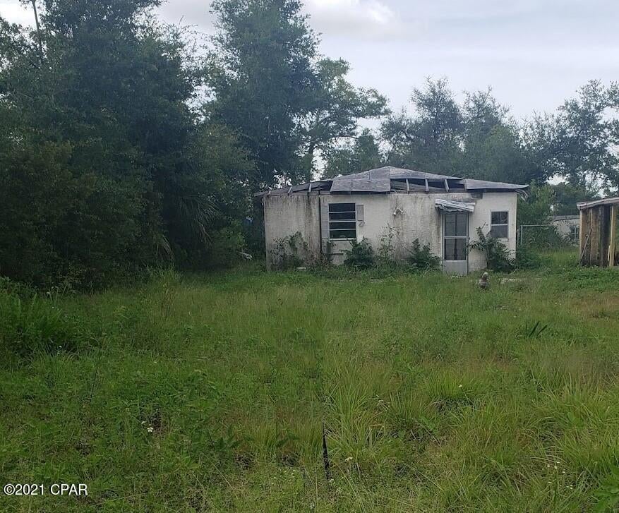 UNDER CONTRACT. SELLER ACCEPTING BACK UP OFFERS. ATTENTION INVESTORS! Seller is in the process of pulling a permit to repair the roof. This 2 Bedroom 1 bath block home needs work due to Hurricane Michael damage but has potential. The structure has been gutted and ready for you to make this a wonderful home. This is a perfect opportunity to rebuild this home and add to your rental inventory or flipped property. Great location near downtown Panama City and just a few blocks from the hospital. This home sits on a double lot, leaving plenty of room to add a carport or garage. Home has an alley behind it maintained by the city.