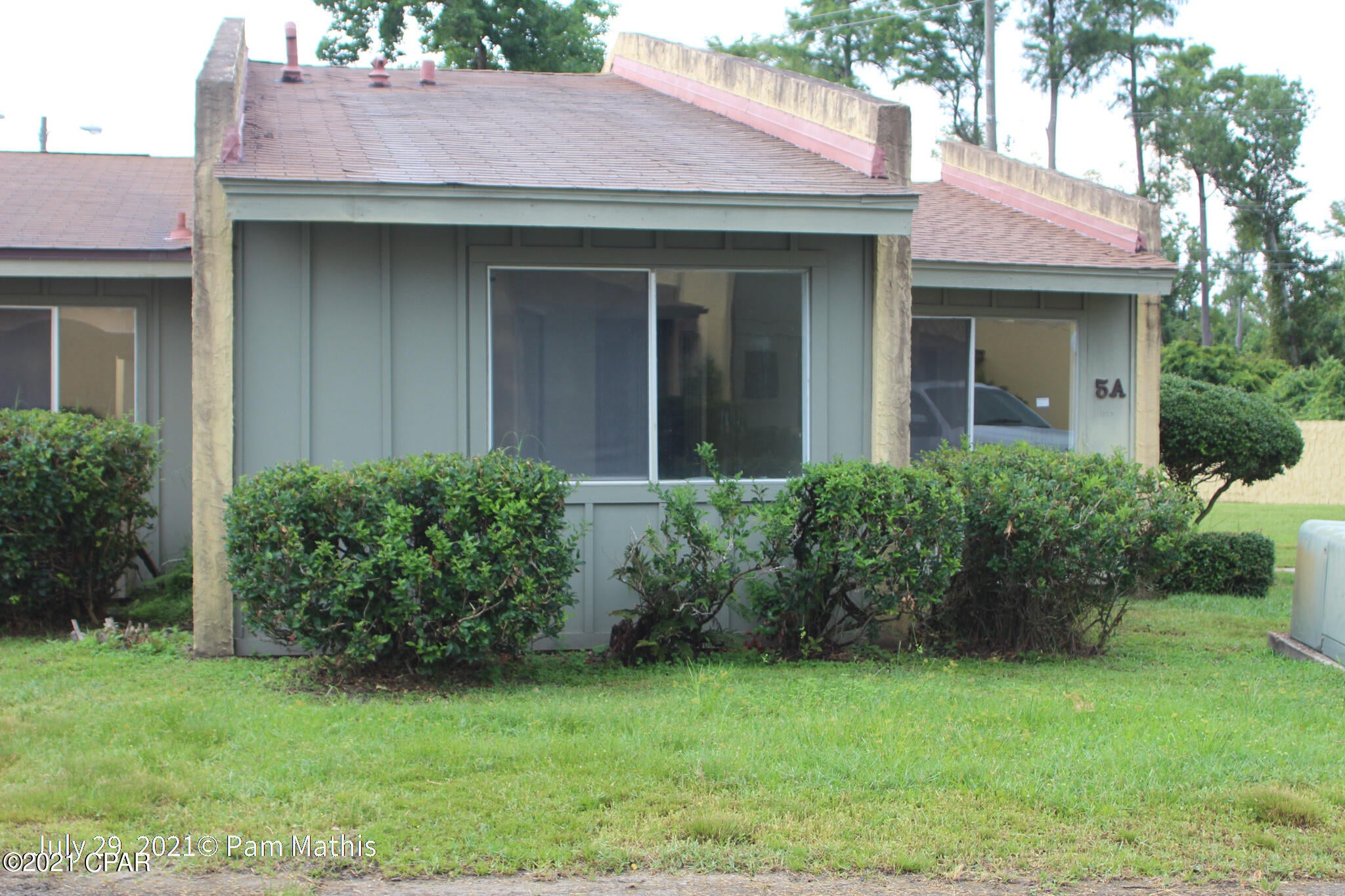 This 3 bedroom 2 bath unit has a very large floor plan.  The living and dining are are an open L shape with a full kitchen and laundry room    An additional work/living area on the back of the home has 2 large closets for storage and access to the back yard.  The back yard is enclosed by a privacy fence, has a concrete area as well as a nice storage building for a small workshop or just extra storage, whatever you need.