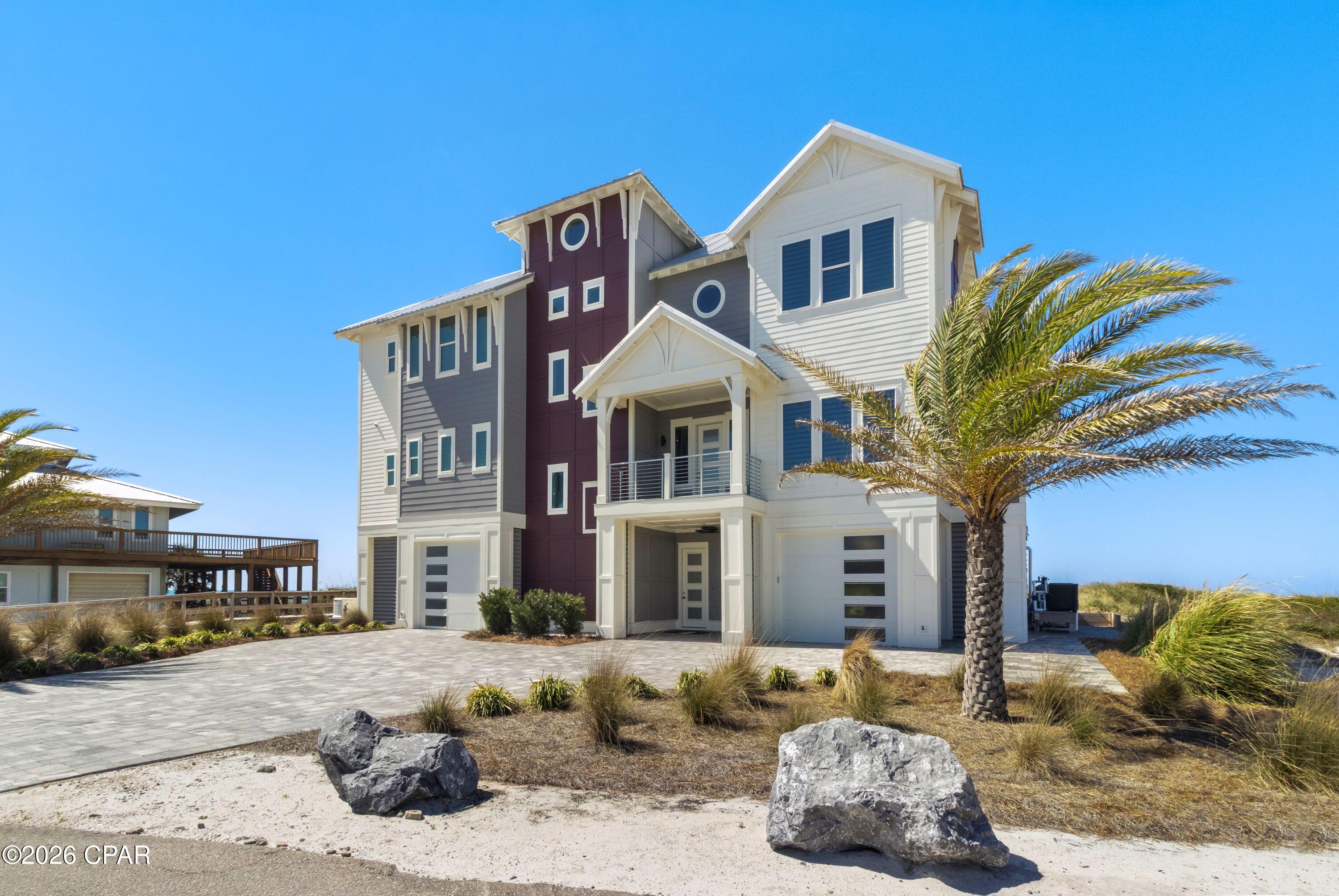 Introducing a Gulf-front luxury masterpiece on Cape San Blas--an absolute showstopper with undeniable WOW factor from the moment you arrive. This extraordinary 6-bedroom home features ensuite bathrooms in every bedroom, creating the perfect balance of privacy and luxury for family and guests. The ground level is pavered with abundant covered parking and generous space for entertaining. A private elevator services all three floors, providing convenience and accessibility throughout the home. The chef's kitchen is nothing short of spectacular, designed to impress with two large islands, extensive custom cabinetry, and top-of-the-line appliances including a Sub-Zero refrigerator/freezer, wine fridge, WOLF convection double ovens, induction cooktop, ice maker, and dishwasher. The stunning backsplash tile serves as a true centerpiece, while designer lighting fixtures throughout the home elevate the overall aesthetic. The expansive main living area, complete with a fireplace, opens onto a Gulf-front balcony overlooking the infinity-edge pool and hot tub. Outdoor living is taken to the next level with an outdoor shower and ample space to relax while taking in the breathtaking Gulf views with your private beach walkover The first living floor features two bedrooms with ensuite baths, a private office, convenient half bath, and utility space. On the third floor, a second living area with wine fridge, sink, and bar creates a perfect gathering space centered between the remaining four bedrooms. Plush carpeting invites comfort in each room. Two bedrooms face the Gulf with stunning views, while the other two enjoy views of St. Joseph Bay. The owner's suite is a luxurious retreat, featuring an elaborate bathroom, walk-in closet, and a hidden surprise--step outside to experience the private Gulf-front outdoor shower. While the home has not been used as a rental, rental projections are available, for a remarkable opportunity. Home also features Generac generator for piece of mind.
