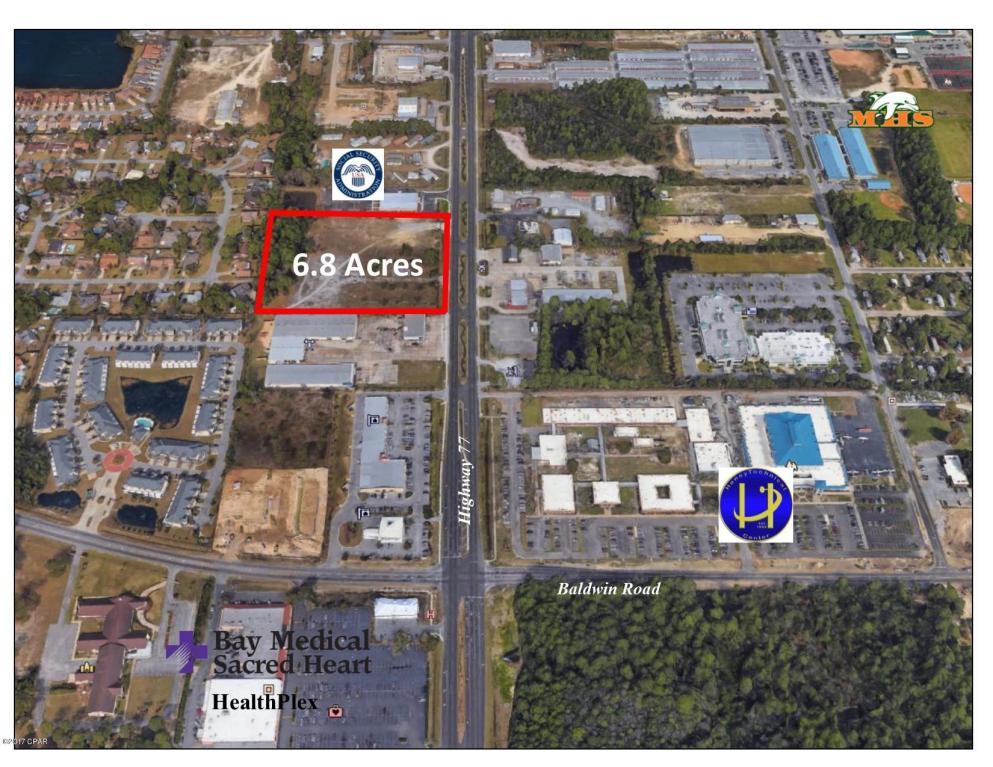 The 6.77 Acre property is zoned commercial within the Lynn Haven city limits. Excellent location for hotel, office, restaurant, office, entertainment, retail stores, service stations, auto repair, dealerships, theaters, family entertainment, etc..  The new Social Security Administration Office is immediately adjacent on the north side of the property. Land can be subdivided and sold separately. No lot less than 1 acre to be sold. Four lane divided highway with 30,000 traffic count per day. City water and sewer available. All utilities available, electric, natural gas, cable.