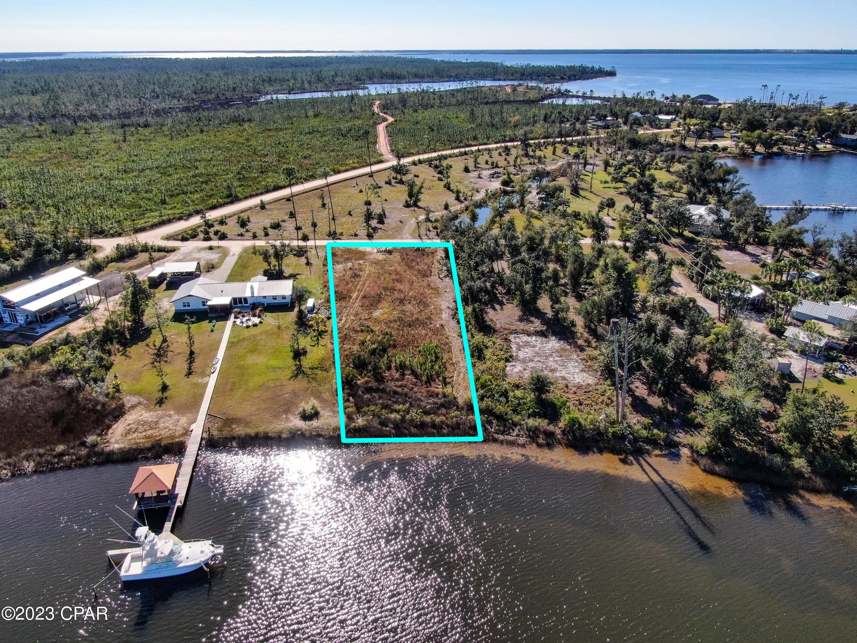Amazing Waterfront Lot! Truly one of the rare deep water lots that is ready to be built on. Lot is cleared and is ready for your dream home. Wildlife and Marine life is abundant all around. 45 mins to the Gulf. This lot is a must see, you will be amazed at the natural beauty still available so close to Tyndall and Callaway. This lot is located at the end of Primrose Lane and is in its own private area but with no HOA. See the map and picks to see how much privacy and beauty this one of a kind lot holds. Located in the city of Callaway and consistently near shopping and schools. Check out this one of a kind jewel for yourself. Owner Financing with an adequate down payment may be available. Older Survey Available