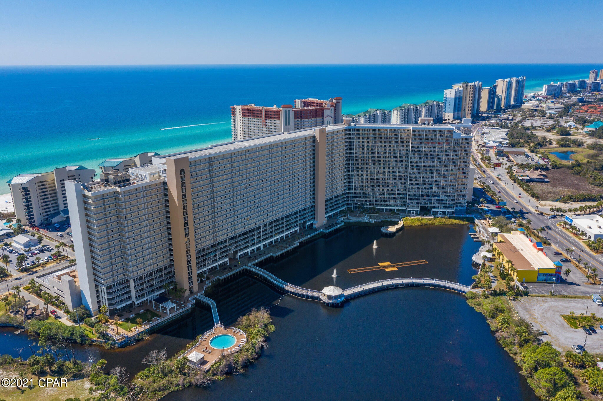One of the best views in the building from this 7th-floor unit of Laketown Wharf! Amazing gulf views from living room! This 1BD/2BA 9ft Ceilings, 1,047 sqft., this unit comes fully furnished and turn-key. Resort-life with awesome restaurants (Juan Taco, The Wharf, and Lorrie Morgan's Spicy Hot Chicken Coop) and shops on the ground level along with the 52,000 sqft. of lakefront Boardwalk and a nightly fountain & light show. Reasonable HOA fees of $473 a month that includes water, sewer, cable/TV, pest control plus amenities such as gated beach access, 5 community pools (1 heated year-round), kids Playground. hot tubs, mini-golf, Splash Bar & Grill, fitness center with gulf views, 2 covered parking garages. All information are deemed correct, buyers should verify if they are important.