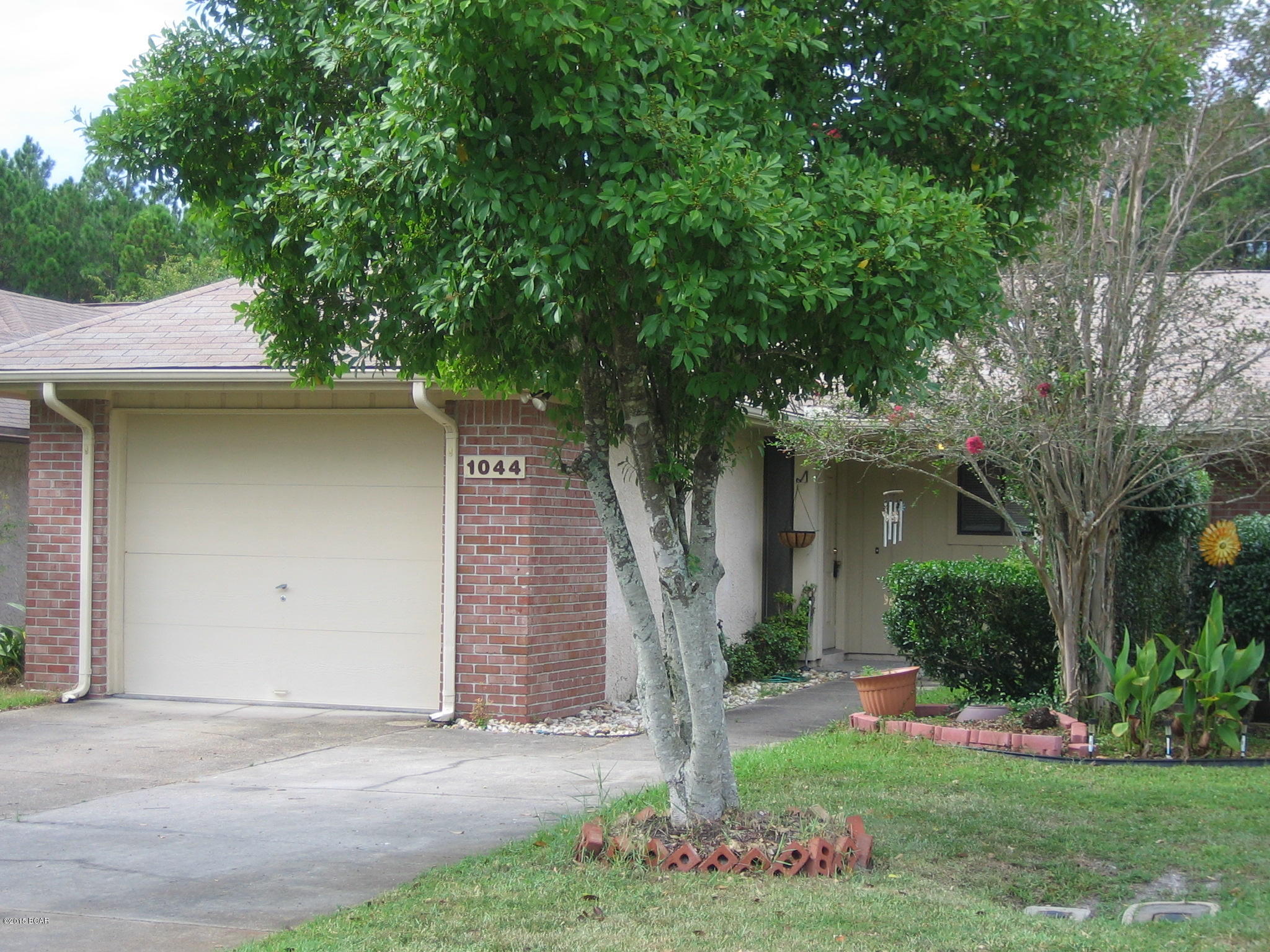Spacious 2 bedroom, 2 bath townhouse near North Bay Haven school in historic St. Andrews. This brick and stucco duplex features a spacious ceramic-tiled Florida room that overlooks a private pond. Features include a fenced back yard, patio, laundry room with full size washer and dryer hookups and attached one car garage.