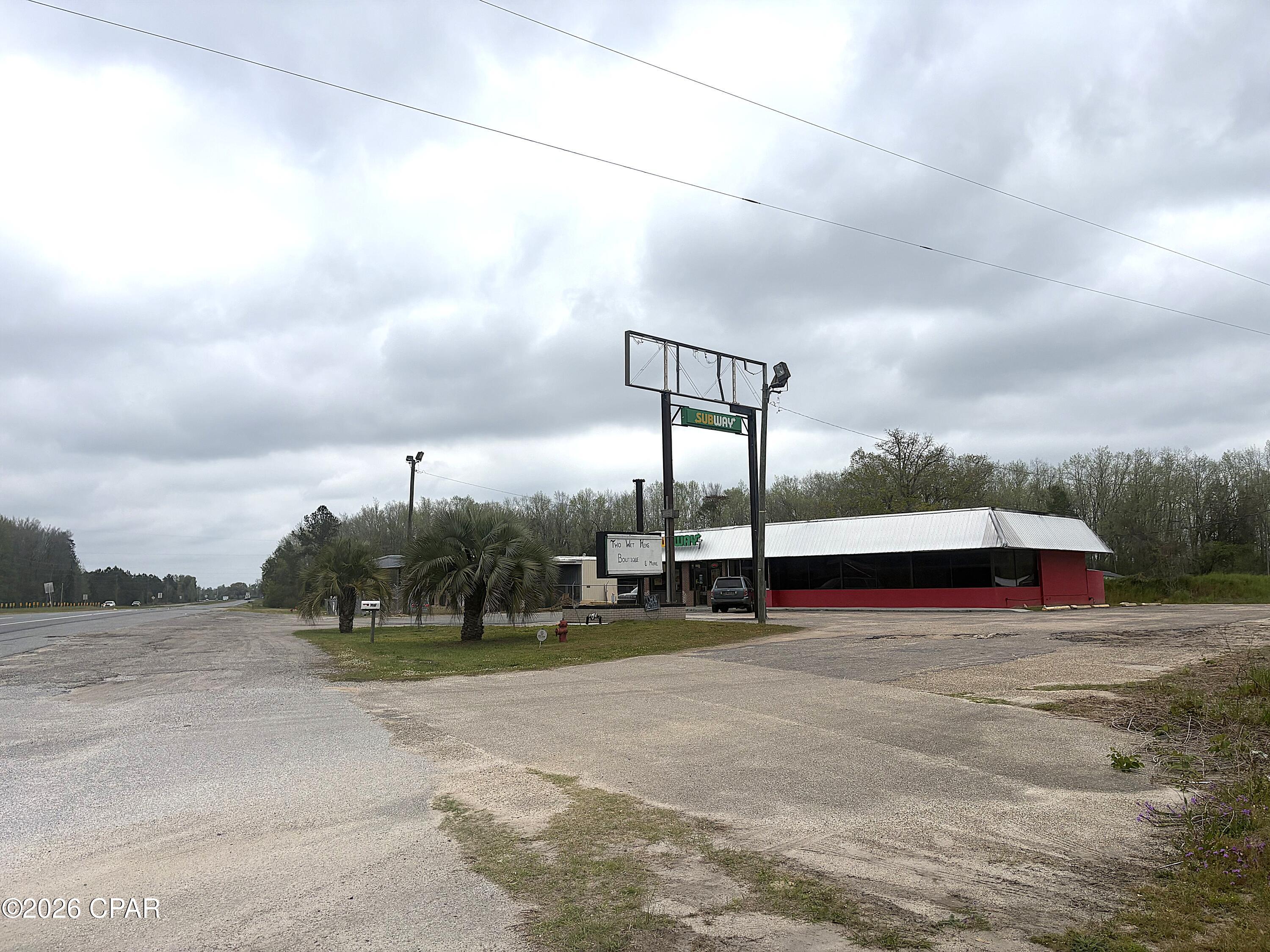 3096 Sq Ft building with 123 +/- front foot on Hwy 231 just North of I-10, FDOT daily traffic count of 10,800 on Hwy 231 and between 25,000 to 27,000 on I-10. One part of the building is currently rented to Subway which is month to month incase you want to use the entire building. or re-negotiate a lease. Both sides of the property have been used in the restaurant business in the past. Current monthly income is $1650 ($19,800 annually)
Public Water and sewer on site, FPU is the electrical provider. 
This property and location could be used for most anything with it's location and layout, Fresh produce, Pawn shop, food service, ect...