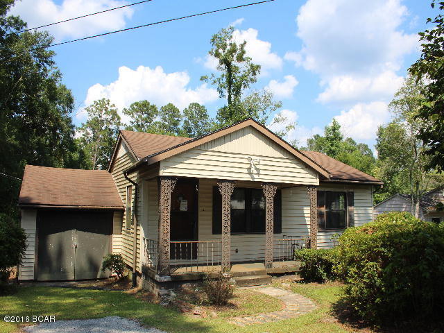 ** PRICE REDUCTION ** Cottage style home in town on nice lot with pretty back yard. Home has 3 bedrooms and two baths. Downstairs you have a large den that overlooks the back yard. There is an enclosed workshop in what was a one car attached garage at one time. This would make a perfect home for the retirees or a great investment property! Don't wait, make appointment to view this one today!!