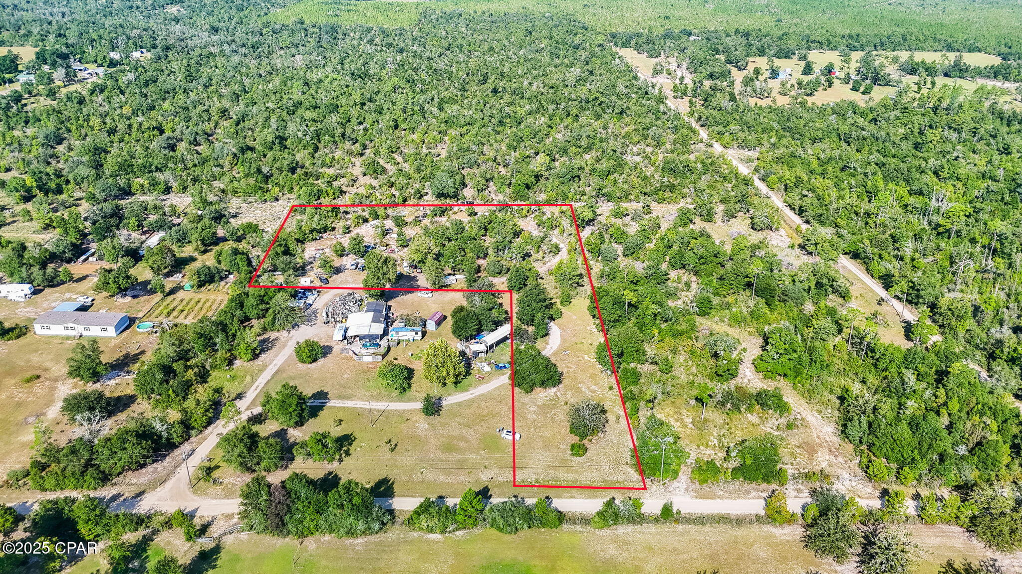Discover the perfect place to bring your vision to life with this 3.21-acre parcel of high-and-dry land. Tucked away in a quiet rural setting yet conveniently located near State Road 20, this property offers the best of both worlds — serenity and accessibility. Spend your weekends exploring nearby natural gems like Econfina Creek and Blue Springs, or simply enjoy the wide-open space and peaceful surroundings at home. Whether you dream of building your forever home, creating a private getaway retreat, or starting a small hobby farm, this property offers endless possibilities. A recent survey is available. Well and septic have not yet been installed, allowing you to customize your property exactly as you envision it. Come make this beautiful slice of country your own.