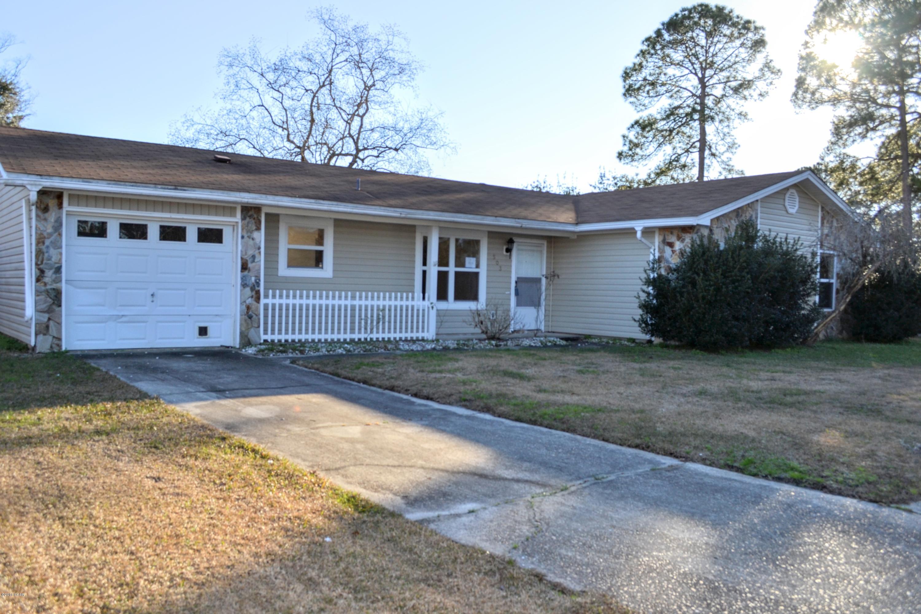 Your going to absolutely love this 4 Bedroom 2 Bath home located in sought after Lynn Haven Florida.  In close proximity to schools, shopping, entertainment and hospitals.  This home boasts a spacious living area with a gorgeous wood burning stone fireplace, seizable eat in kitchen with quite a bit of cabinet and counter space, large master bedroom with master bath, a garage to store all you toys and a fenced in back yard with a huge deck for entertaining.  The neighborhood has sidewalks throughout for walking and is just a quick walk to Cain Griffin Park.  Experience all that Lynn Haven has to offer call your agent today to arrange a visit.  All measurements, room sizes and ages approximate.  Please verify if important.