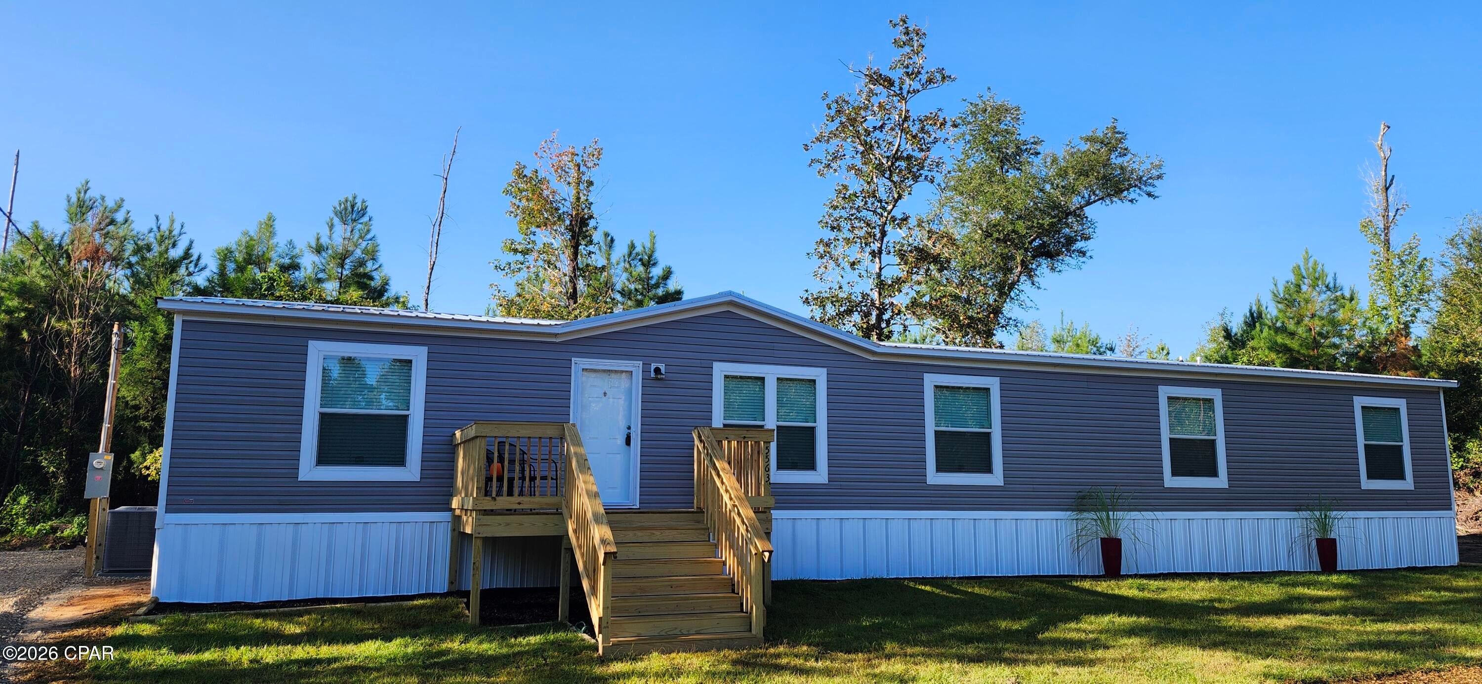 BRAND NEW 5-BEDROOM MANUFACTURED HOME ON 2.4 +/- ACRES!

Welcome to private country living in Marianna, Florida! This brand-new 2026 manufactured home with Metal roof that offers approximately 2,001 sq. ft., 5 bedrooms, and 3 full baths on 2.4 +/- private acres.

The spacious split-bedroom floor plan features an open-concept living area, separate family den, beautiful kitchen with stainless Whirlpool appliances, large island with seating, soft-close cabinetry, built-in microwave, coffee bar, and walk-in pantry. The private primary suite includes a walk-in closet, double vanity, soaking tub, and separate walk-in shower.

Additional features include a metal roof, 2-inch faux-wood blinds, quality insulation, full-house water shut-off valves, and a 10-year warranty.

Enjoy plenty of room for family, recreation, gardening, animals, or simply relaxing in your own private setting while remaining conveniently located near Marianna amenities and outdoor attractions.

5 BEDROOMS • 3 BATHS • 2.4 +/- ACRES • 2,001 SQ. FT. • BRAND NEW • 10-YEAR WARRANTY

Call today to schedule your private showing!

Interior photos include AI-generated images for illustrative purposes, along with photographs.