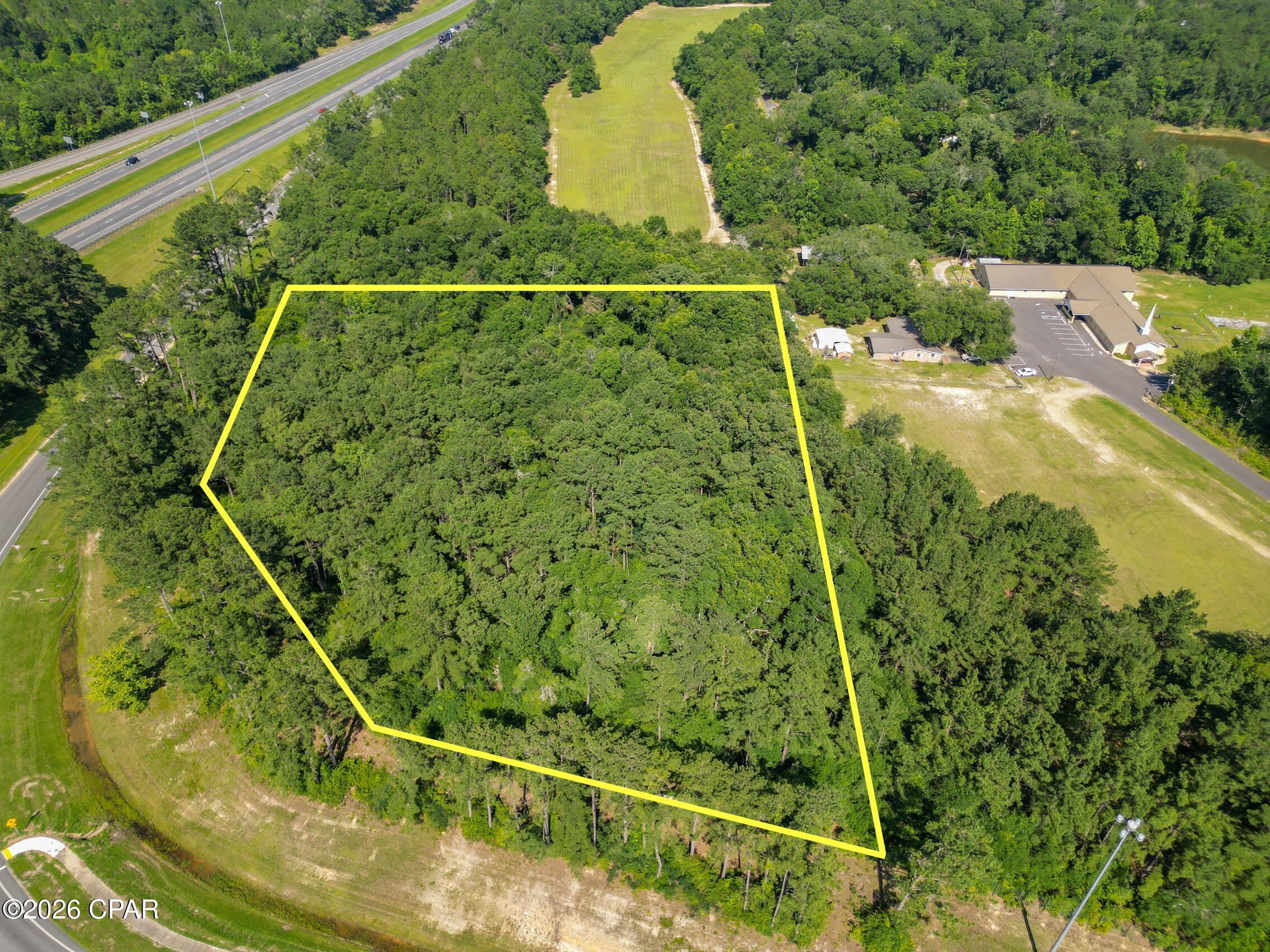 3.92+/- acres of prime commercial property at the intersection of Highway 77 and I-10 in Washington County. Frontage on Highway 77 and the entrance ramp to eastbound I-10. Legal access to property to be negotiated with adjacent property owners. Access will be from Blue Lake Road off Highway 77. New Washington County alcohol ordinance allows sale of ''on premises'' beverages with alcohol in a state licensed restaurant on this property. City of Chipley municipal water, sewer are now available & natural gas casings under I-10 to service this area of commercial properties have been completed. Additional contiguous land also available.  00000000-00-2350-0000 & 00000000-00-2347-0002 with total acreage of 6.92 acres, see MLS# 790932.