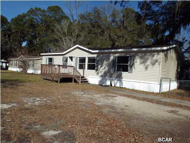 REDUCED!!! Three bedroom Two bathroom Manufactured home on a corner in Callaway offered as is. The property is has a chain link fence, front deck and back porch porch. All sizes are approximate of taken form other sources please verify accordingly.