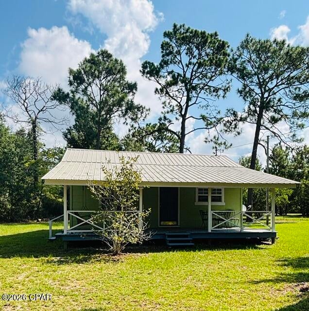 Charming little Florida Cottage completely refurbished. 2-bedroom 1 bath includes a washer and dryer combo, fridge, stove and dishwasher while also being located within walking distance to Deane Bozeman School. Perfect for a starter home, small family or retired couple.  Dollar General is within walking distance as well. The property is a little over an acre and is fenced in that includes a pump house with a carport cover for a lawnmower and lawn tools along with a 20x20 shed with a carport cover. The shed has a new metal roof and allows for plenty of storage. The property also comes with 2 full camper hook-ups with water, electric and sewer which is perfect for company to come and stay in their RV! While the company is here, the home comes with a big, covered porch. Perfect for cookouts and talks on the swing, the porch is the ultimate place to be if you are trying to relax! This is a must see!