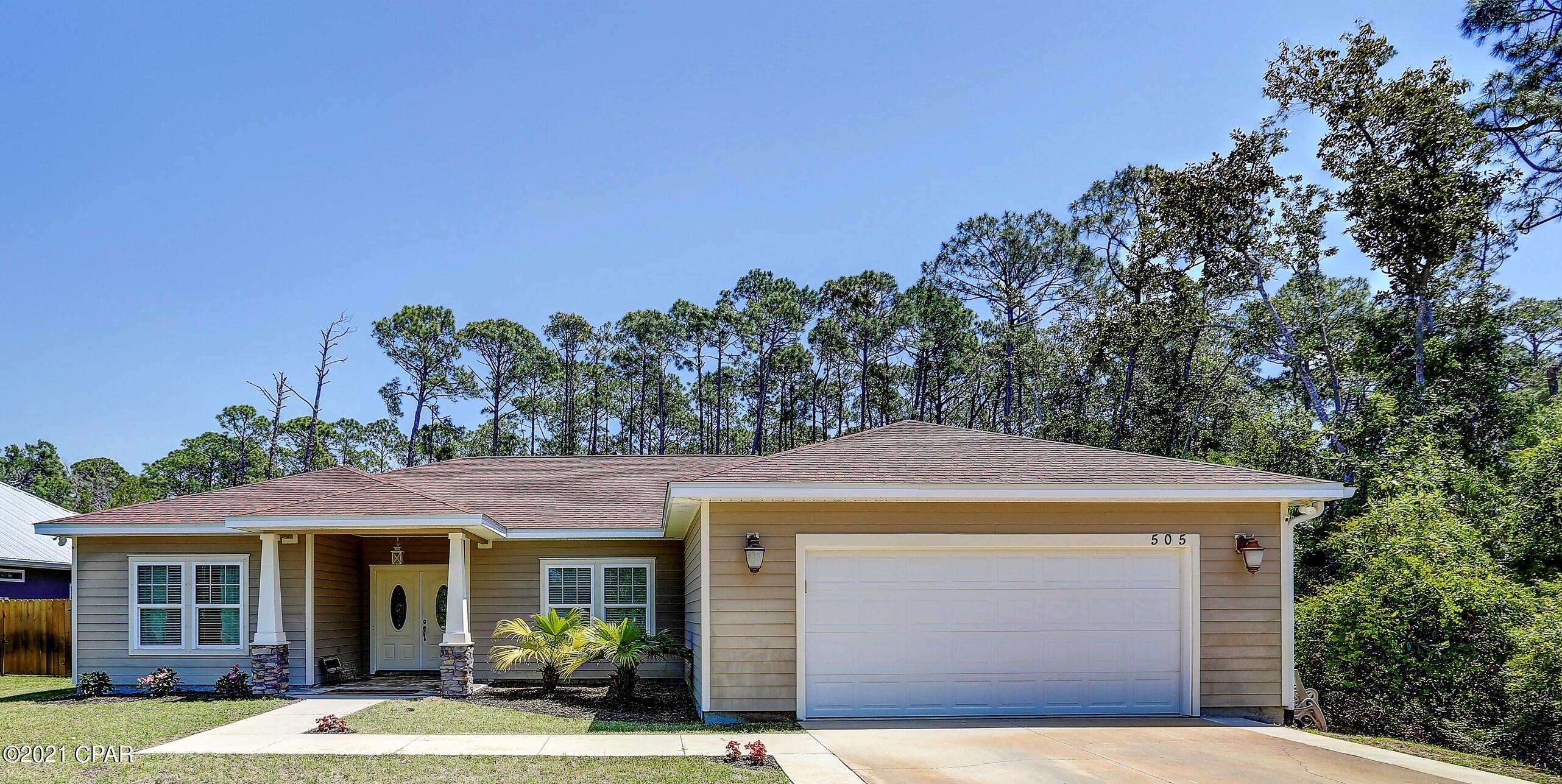 Craftsman style 3/4 bedroom 2 bath, 2,100+ sq ft home in Hidden Pines Community. NO HOA! Privacy fence and NO NEIGHBORS on 3 sides! Less than two miles to Navy Base and less than 5 miles to Grand Lagoon and the beaches of PCB. Home features split bedroom floorplan, trey ceiling in Great Room and Master Bedroom. Central Great Room is perfect for entertaining. Large kitchen island, stainless steel appliances, custom cabinetry and solid surface countertops. GIANT master bedroom with en-suite bath. Master bath holds soaking tub, separate oversized shower, walk in closet and double vanity. Split bedroom plan offers two oversized additional bedrooms and 2nd bath with double vanity. Home has nice flex space with closet that is currently used as office but can easily be used as 4th bedroom.