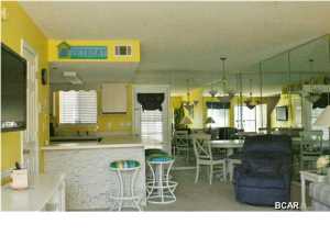 If you are looking for that ''Beachy Decorated'' Condo at the Beach... this is it. This is a very nice 2 BR unit that is very close to the Beach Walk. This ''Gated Resort'' features 11 Pools (5 Heated), 4 Tennis Courts (2 Lighted), An 18 Hole Putt Putt Golf Course, several Shuffleboard Courts, a Conference Center, Fitness Center, Wi-Fi rooms, and a Clubhouse with a Pool directly on the Beach... there is NO EXTRA CHARGE to use any of these amenities. This Resort is great for Walking, Jogging, and Bike Riding. You even own the 2 Parking Spaces in front of your unit along with the Front & Back Yard. NO Elevators to wait on and NO hunting for a Parking Space! This is not a ''Condo'', so they are much easier to get a loan on. The HOA dues are only $410/Qtr equals ($137/month) the du