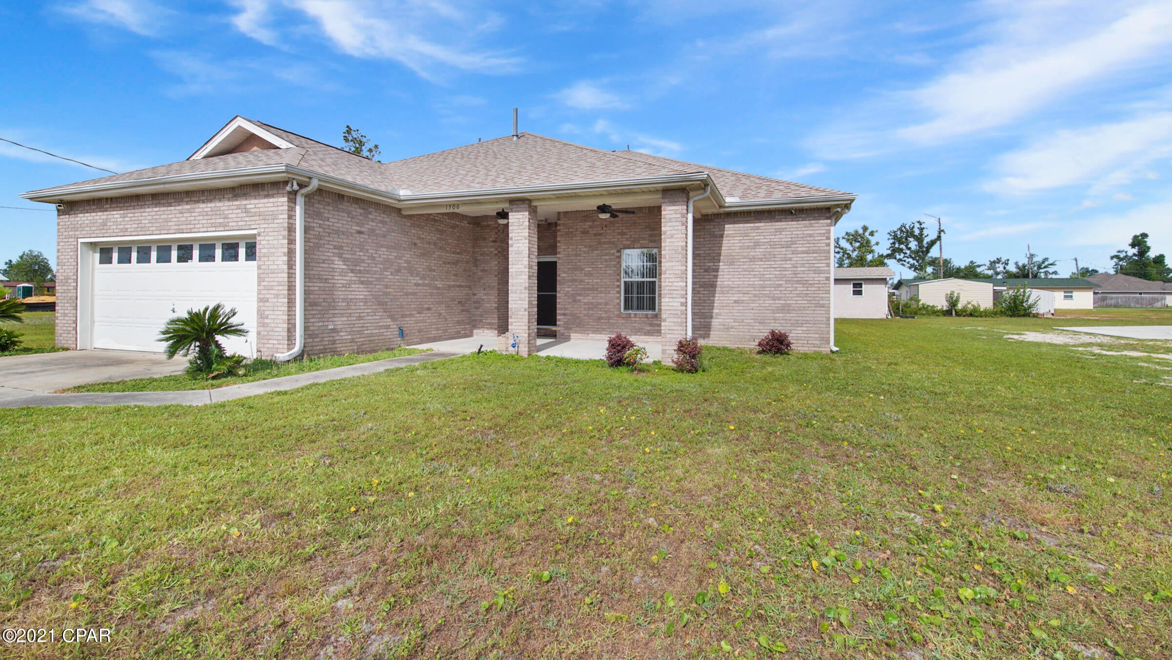 Looking for a home in Lynn Haven, look no further.  This spacious three bedroom, two bath home is centrally located only a few blocks from the newly renovated Cain Griffin Park.  A new roof in 2018 for the home and workshop, new gas line to interior kitchen range fireplace and back patio for an outdoor grill.  In addition wood  plank vinyl flooring in the dining and living rooms, new painted entire interior, new vanity and cosmetic updates in the hall bathroom.  All sizes approximate and taken from public records, buyer to verify any details deemed important.