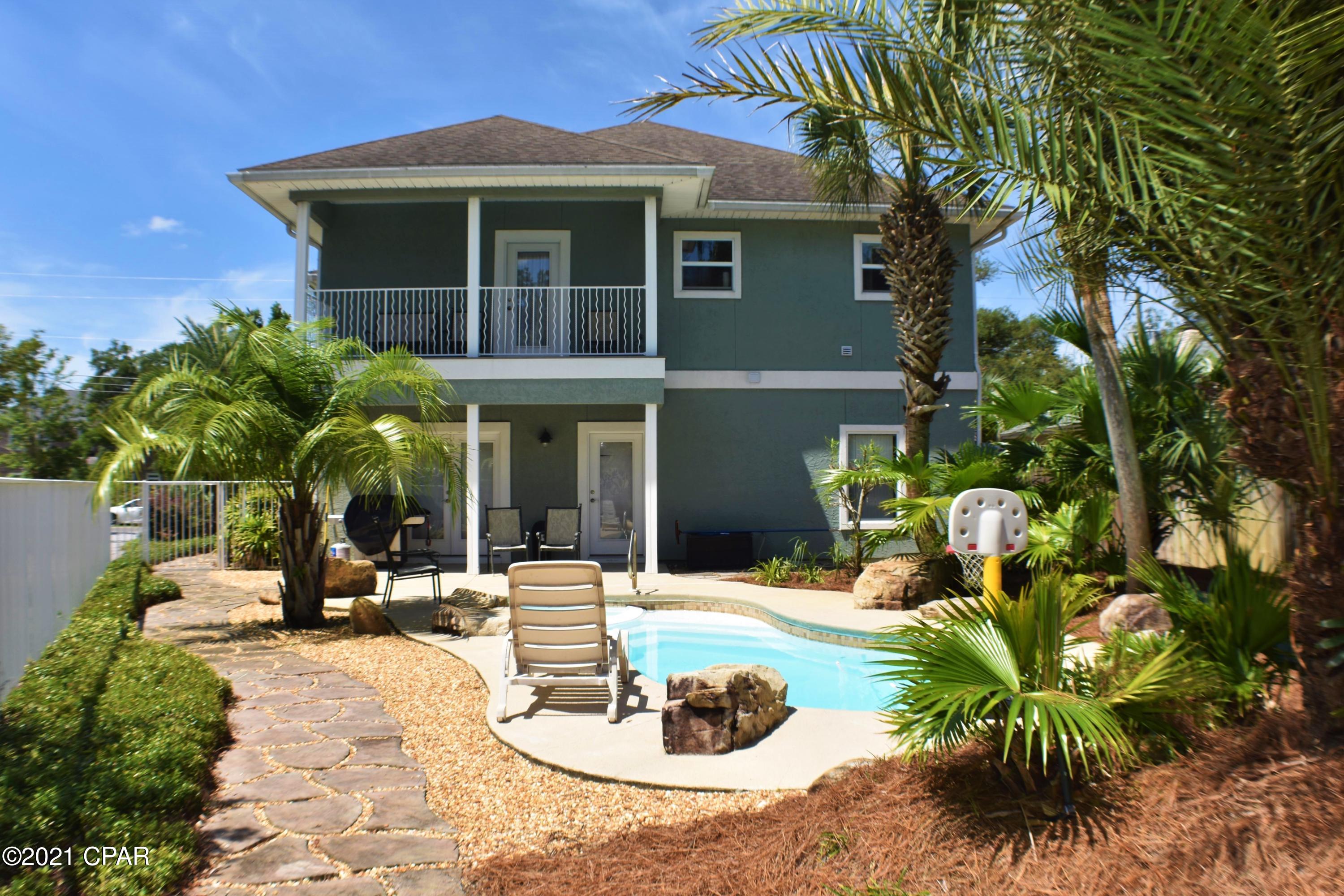 CURRENTLY UNDER CONTRACT, SELLER ACCEPTING BACKUP OFFERS.  Enjoy the view of St. Andrews Bay from both the first & second floors of this custom built home in the Garden District of Panama City! This approx 2,500 sqft, 3BR/2BA home is just one block from the bay & a few short blocks from the Downtown District!  Features include an elevator, hardwood floors, built-ins, front and rear balconies & porches, a garage & circular driveway, & a privacy fenced backyard with in-ground pool & hot tub!  The floor plan is split with a living area, two bedrooms and a bath on the first floor, while the second floor consists of the dining area, kitchen, another living area, and the master suite.  You can even see the water from the master bedroom!  This is a home you need to see in person to appr The two HVAC's area new, the roof was repaired after Hurricane Michael, the pool is saltwater chlorinated, the fence is new as well as the pergola in the backyard, and the hydraulic elevator has new wheels.  All info is approx and must be verified by Buyers if important!