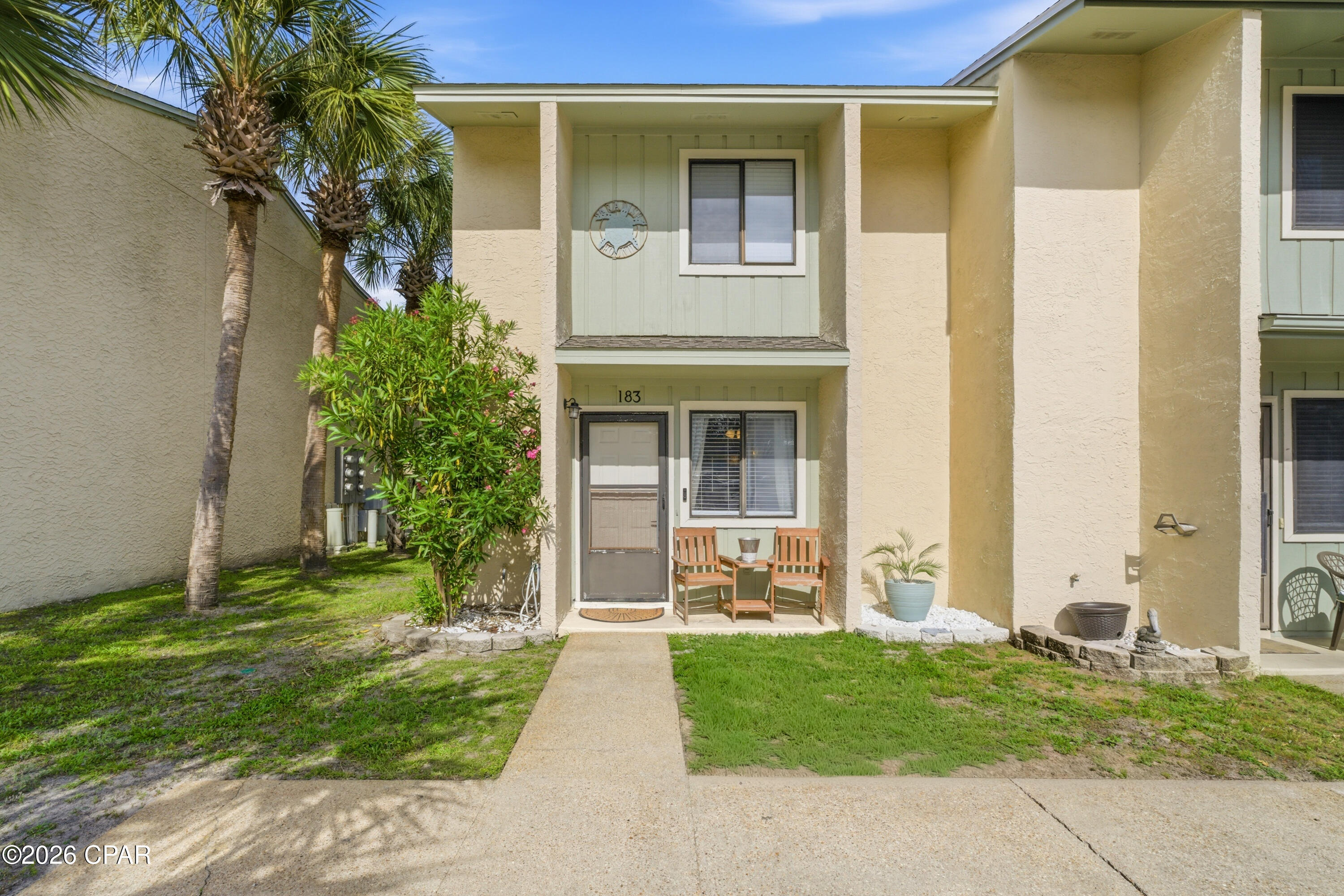 Just minutes from the sugar white sands of Panama City Beach, this inviting getaway places you in the heart of one of the area's most loved beach communities. Whether you're searching for a full-time residence, vacation retreat, or income-producing rental opportunity, this property offers the relaxed coastal lifestyle buyers are looking for.

Inside, the bright open living and dining area creates an easy flow for gathering after a day on the water or exploring the nearby restaurants, entertainment, and shopping. The kitchen offers generous cabinet and counter space with a breakfast bar that keeps everyone connected. Sliding doors lead to a covered outdoor patio overlooking the community green space, creating the perfect setting for morning coffee or winding down after sunset beach walks.

The spacious bedrooms provide comfortable accommodations for family and guests, while the private balcony adds another place to enjoy the warm Florida breeze. Neutral finishes throughout make it easy to personalize and start enjoying immediately.

Located in Gulf Highlands Beach Resort, residents and guests enjoy access to resort-style amenities including pools, tennis courts, and a beachside lifestyle just moments away. Spend your days boating, fishing, dining on fresh seafood, shopping at Pier Park, or simply soaking in the coastal atmosphere that makes Panama City Beach such a sought-after destination
