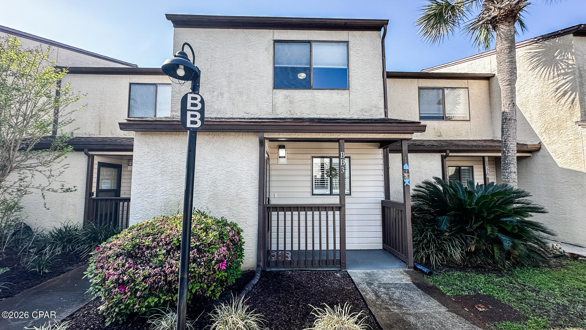 CURRENTLY UNDER CONTRACT ,SELLER WILL CONSIDER BACKUP OFFERS Welcome to Portside BB3 and start living the beach life in this completely remodeled unit in 2022/2023.There was not one thing that was looked over to make BB3 a WOW factor .
 Popcorn ceilings smoothed throughout  and the entire unit repainted. The kitchen was expanded to allow two people to use the space.  New cabinets, quartz counter tops and new stainless  appliances. The pantry was rebuilt and turned from the hallway into the kitchen.  Soft closing shelves installed all behind a water cascading glass door. Plantation shutters installed in the kitchen, living area and master bedroom. Can lighting installed along with new ceiling fans. A humid stat ( HALO) was added to the air handler to help control humidity in the unit. The space designated for the washer/ dryer was reconfigured for a stackable set thus allowing custom built shelves for supplies and storage. New laminate flooring installed throughout. A carpet runner was installed on the steps going upstairs. The master bedroom has a queen bed against a wood trimmed accent wall.  Two closets that were customized to increase storage space.  
 Off the bedroom is a large deck rebuilt in 2024, with a beautiful view of the landscaped area behind the unit.  Additionally there is a privacy screen and ceiling fan to allow spending time outside year round. The master bathroom was also remolded to include a soaking tub thus allowing the owners a true full size master bath.
The guest bedroom comes with two new full size beds against a trimmed accent wall Two closets that were customized to increase storage space . In the upstairs hallway a heavy duty 350 lb. pull down attic access was added.  The attic space had additional insulation added and the deck space was floored allowing for a large amount of storage space for the owners.• On the main level back porch, a swing was added to relax in, and the storage closet was finished out to maximize the space for all those beach toys.  There is an outdoor shower also in place to help rinse off before going inside after a day at the beach, pool or early morning  pickleball at Portside . Portside has three pools, the upper pool is heated during the winter months.  The community is dog friendly with several open spaces to walk and play with your pet(s).  There is a fitness area and a clubhouse.  The clubhouse includes restroom facilities, a pool table, ping pong table, darts and both a library and DVD  section. The clubhouse is available for events. Come out and see what Portside has to offer on the quiet west end of the beach .