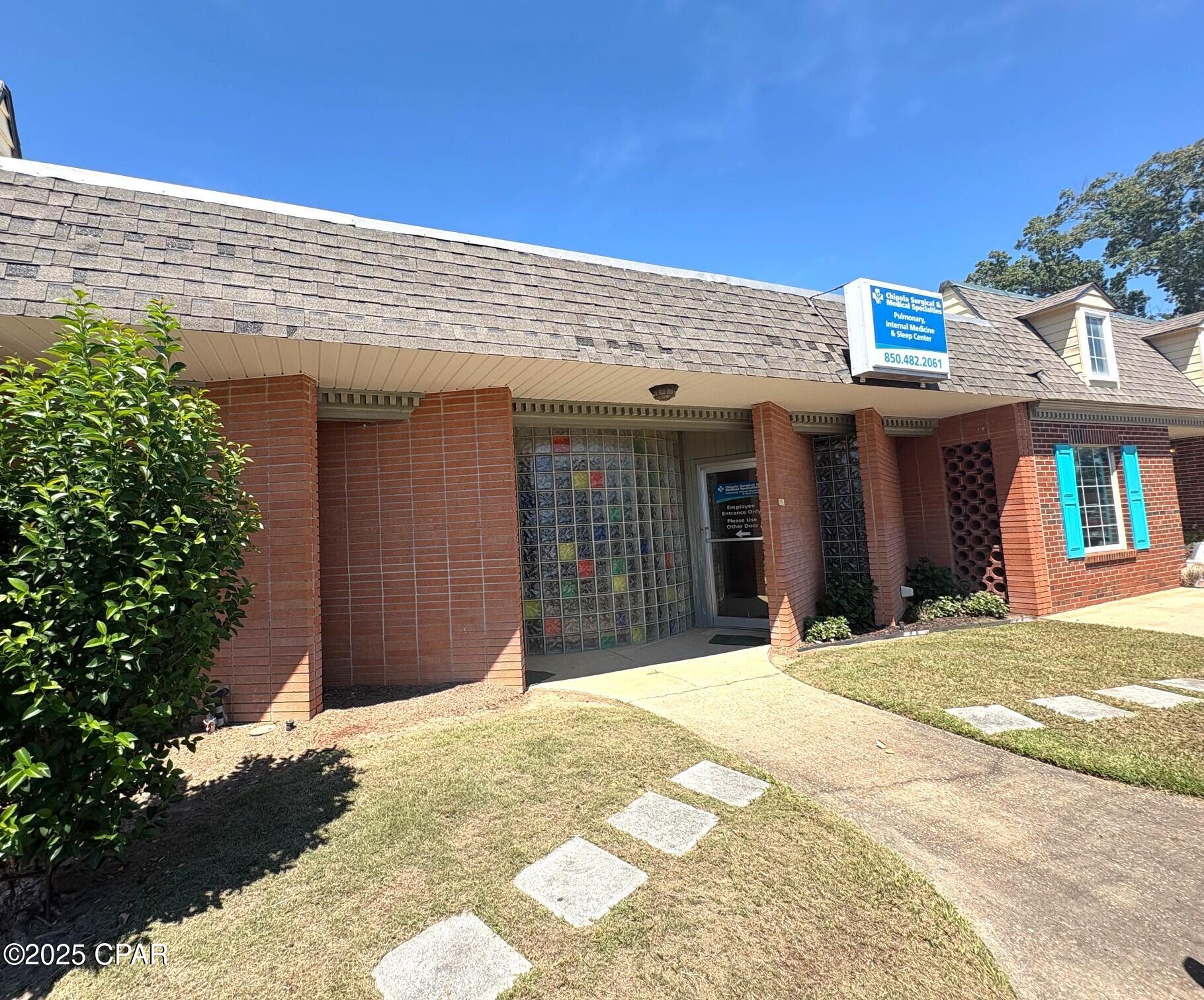 OFFICE SPACE in Marianna located in the medical community directly across the street from the Marianna Nursing Home. One block from Jackson Hospital. The office has a reception area, office, 4 exam rooms, and  2 half baths. there are 6 dedecated parking that belongs with this property along with on street parking. This property is joined by 4290 and 4296 5th Street if interested in the 3 offices.