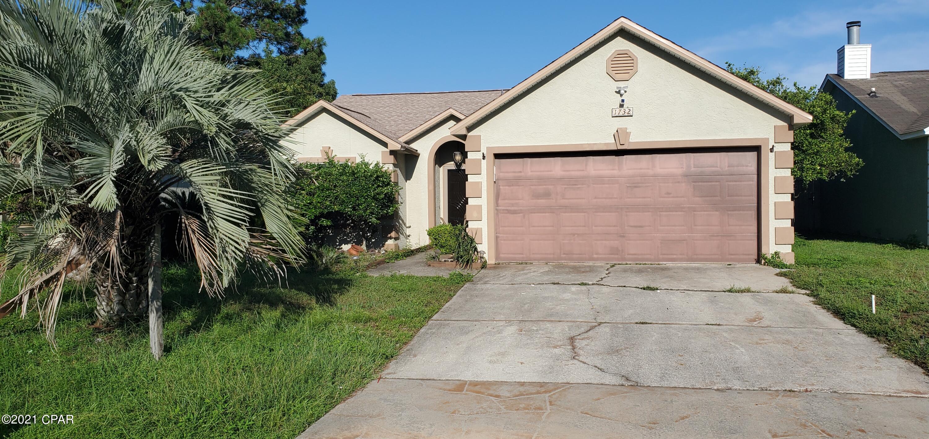 Under contract seller taking backups. Single-family home centrally located off of Panama City Beach Parkway and Front Beach Road less than 10 minutes to the beach. This home has a lot of character as noticed by the landscaping and as you walk under the pergola in through the stunning etched glass front door.  There is a spacious living room with French doors leading out to the Florida room where there is a wooden deck, 8 foot privacy fence, and well-maintained and operational hot tub.  The walls are beautifully painted with brick and floral accents, wood-laminate flooring, a hanging wine glass rack in the kitchen with bright white glass door cabinetry to display your kitchen and glassware.  Lastly, the hot water heater was replaced in 2018 and a new roof was installed in 2019 with hurricane shutters for all windows and doors