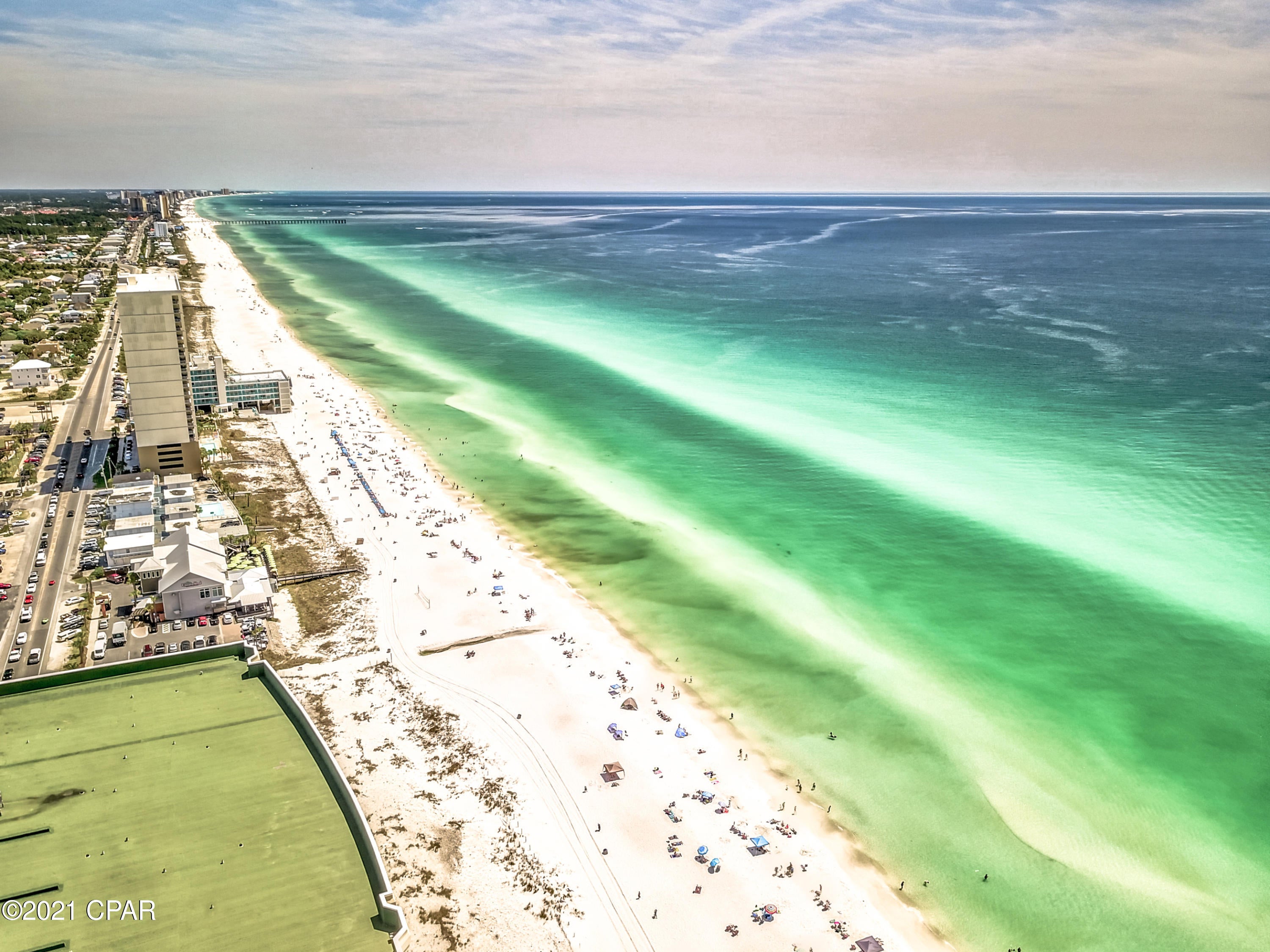 Rare Gulf-Front Penthouse at the Emerald Beach Resort. Unit #2433 is one of the two penthouse floors with expansive gulf views from the living/dining/master. The emerald views are spectacular from the moment you walk through the front door and captivates your attention throughout. Boasting over 1800 square feet, the bedrooms and living areas are wide open, accommodating, and flow perfectly out to the large gulf front balcony for unwinding and taking in the breeze. All 3 bedrooms have their own private en suite baths. List of Recent Updates: New Furniture New Washer& Dryer New HVAC New Dishwasher All new LVP flooring This turn-key, RENTAL MACHINE will not last long. Set up your private showing today!