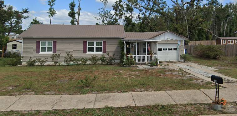 Solid, well-maintained 2/1 bungalow in St. Andrews.  Hardwood floors, large backyard (fenced on 2 sides; posts set for the 3rd), one-car attached garage with additional driveway parking.  Front porch, back deck, and back patio provide lots of space for entertaining or enjoying the outdoors. Utility room in house.  Newer water heater (2013?) and AC (2013?).  Metal roof NOT damaged in Hurricane Michael.  Home is centrally cooled and heated but owner added window units for additional options. Owner installed an LP tank for gas appliances (stove, dryer, and wall-mounted heater), but electric is still available for all. Home has an in-ground sprinkler system on a private well, but the well pump was damaged in the 2018 hurricane, and the owner chose not to repair.