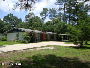 3 Bedroom 2 Bath Block/Vinyl Home on large corner lot in Bonifay, Florida. Almost 2000 sq. ft. of living space. Huge living room with fireplace. Large kitchen with breakfast bar, lots of cabinets and large window over the sink. Has a nice sitting room with new window off the large master bedroom. Large laundry room. Lots of patio room on the back. 2 car carprot with concret drive to the street. Nice and quiet neighborhood. Has new paint inside and sellers are continuing to complete some improvements. Check it out today!!!!!!