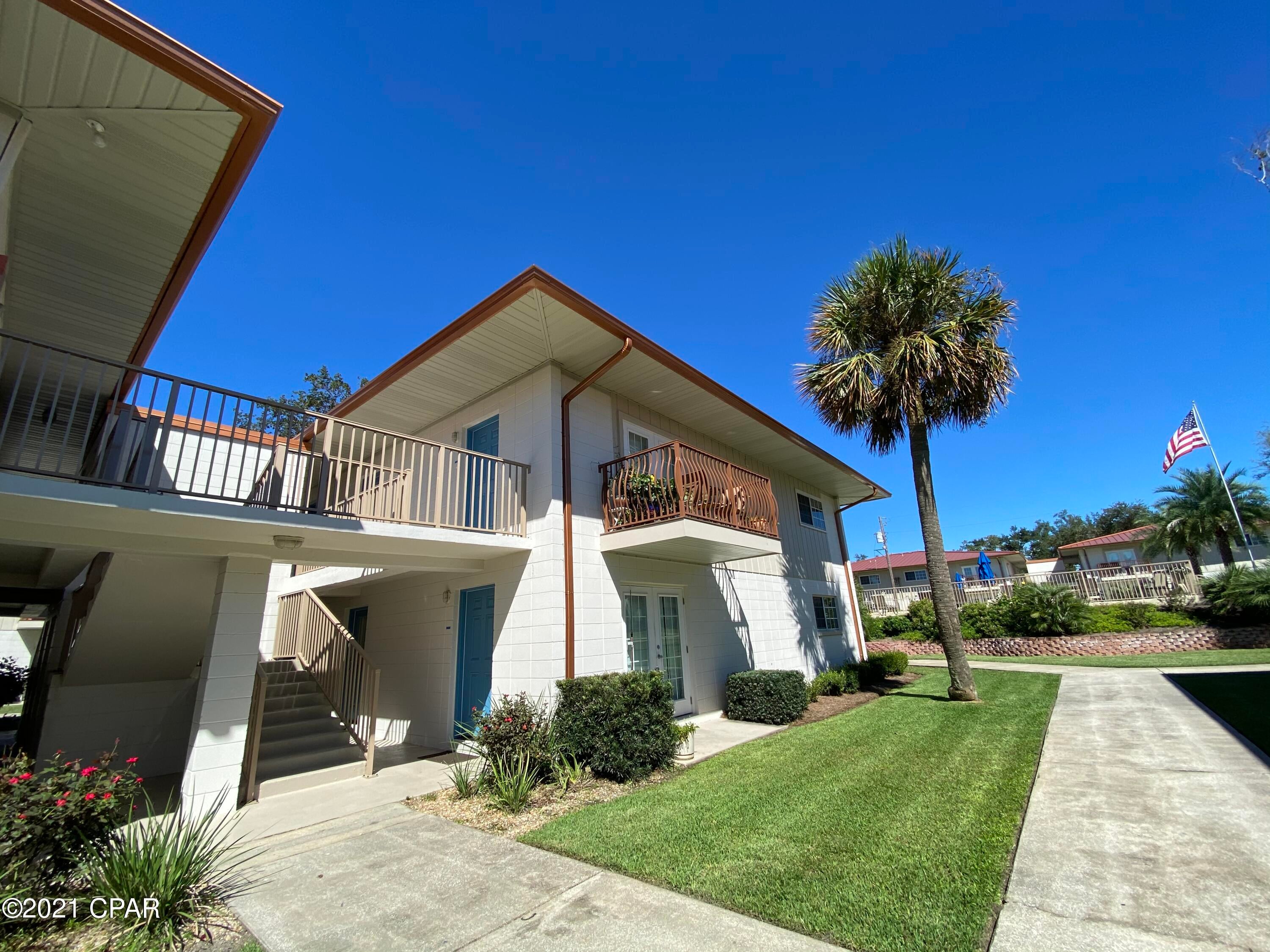 CURRENTLY UNDER CONTRACT, SELLER ACCEPTING BACKUP OFFERS - Landmark on St Andrews Bay is a waterfront community that is well cared for and offers lots of amenities including two pools (one being Bay front), green areas, grills, clubhouse which can be reserved for events, a beach area, and dock with individual boat slips.  This condo is a 2 bedroom 1 bath unit that is in great condition with tile floors, carpet in the bedrooms and walk in closet in the master bedroom.  The condo is on the second floor so no noise above.  HOA fees include grounds keeping, insurance, pest control, common area maintenance, water, sewer, trash, and cable.  Call to see today!