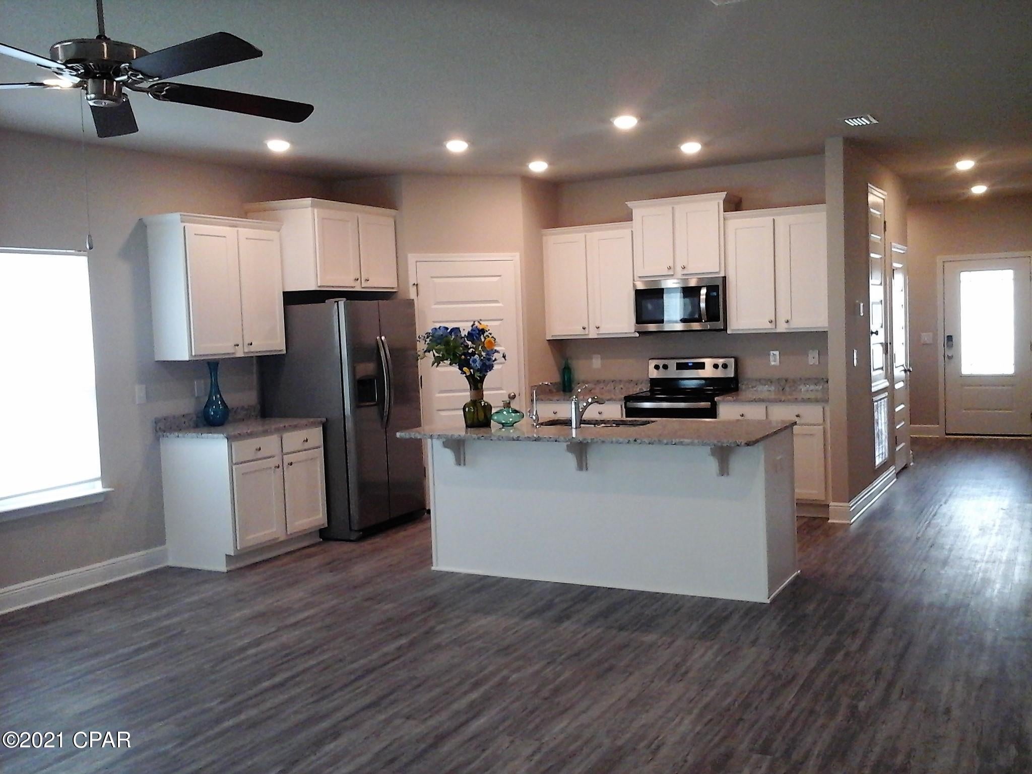 **Please note!! This property is like duplex with one address, is best fit for those who are used to having roommates, for the home is 4bedr/3baths but separated by wall as a lock-out guest house/Mother-in-law Suite with Separate side entrance, complete with its own bedroom, living room, kitchen, bathroom plus A/C Unit. Property manager is occupied the guest house and work from home.  Location of this home simply can't be beat. Close to Thomas Drive and Navy Base! Centrally located in the heart of Panama City Beach near the white sandy beaches. Everything from shopping to golf is just a short drive away. Inside the home you will find EVP flooring, quartz countertops, and stainless-steel appliances! 6 months lease is possible!