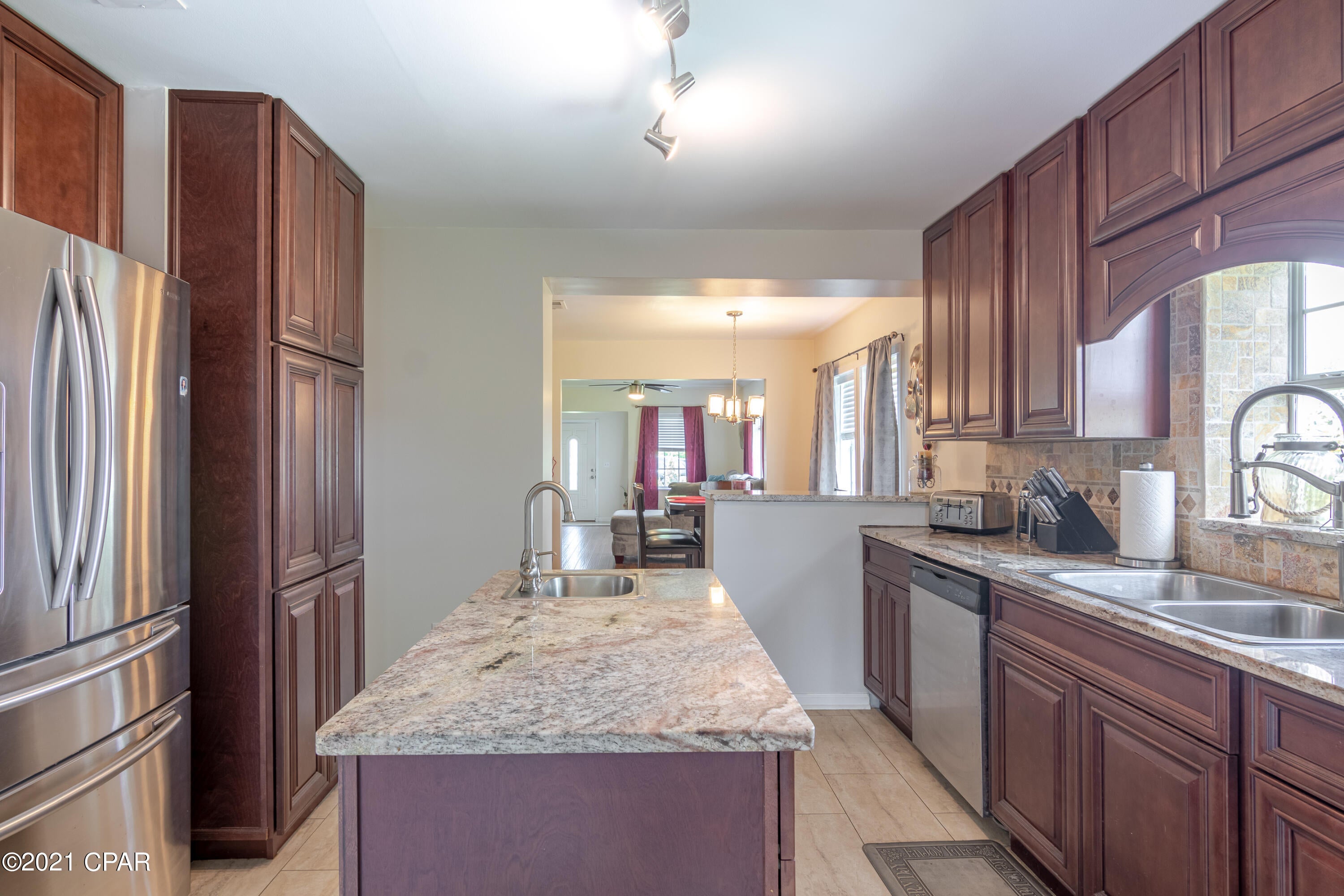 'CURRENTLY UNDER CONTRACT, SELLER ACCEPTING BACKUP OFFER.Back on Market. VA appraisal-$180,000,inspections done/repairs fixed, buyer Financing fell through days before closing.  RENOVATED home with many high-end updates and at this price, won't last long.  The roof was replaced in 2018, tankless water heater in 2018, new fence in 2019, and most of the interior has been updated.  The interior flooring is high-end tongue and groove ''Real Wood'' flooring, or tile, with NO carpet for easy maintenance.  The kitchen is truly a bakers dream with custom dark wood cabinets, a custom pantry, Brazilian Granite counters, beautiful backsplash, stainless steel appliances, and even a free-standing island with a wet bar.  The master bath has been updated to include a new vanity, extensive tile work along with walls, flooring, and surrounding the JACUZZI tub.  The dining room is off the kitchen, and opens to the bright and airy living room, which includes an electric fireplace that will remain with the home.  There is also a separate laundry room.  The seller has taken pride in the landscaping and also has a poured concrete patio, as well as a brick patio, 2 covered porches, and is leaving the 15x20 yard building, and 12x10 yard building, which both have lighting and electric.  Additional features include: New insulation in walls/attic, upgraded lighting/ceiling fans, upgraded kitchen faucet, crown molding, designer molding around windows/doors, all appliances including washer and dryer remain.  The seller has kept the home up with monthly pest control treatment, and 2X p/year HVAC maintenance.  The electrical and plumbing has been updated over the last few years, and the windows/doors over the last 10 years. If this sounds like the home you have been waiting for, contact your realtor for a private showing!  Age, Sq.Ft., Room Dimensions, Schools, or any important information to the buyer must be verified by a personal or professional inspection.
