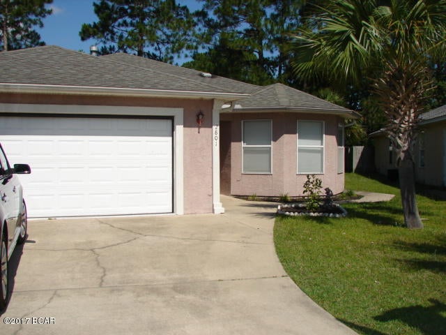 Home located near schools, shopping, dining, entertainment, and just minutes away from Tyndall Air Force Base. This home features a large open floor plan, formal dining room right off the kitchen area, hardwood laminate floors throughout the home, a large master bedroom with double walk in closets, an abundance of storage throughout the home, and a double car garage. The enclosed sun room and the large fenced in yard will be perfect for enjoying the warm Florida summers!