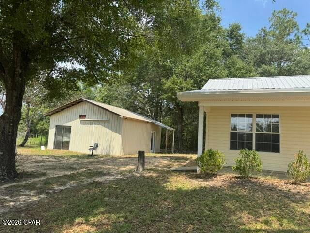 This 2 bedroom, 2bath 1 story home located on 1.9 acres with approximately 241' on Hwy 77 Is move in ready. Zoned single family but, seller says it can be split. Large outbuilding, several other sheds, brand new stainless electric stove & refrigerator. Split bedroom plan.