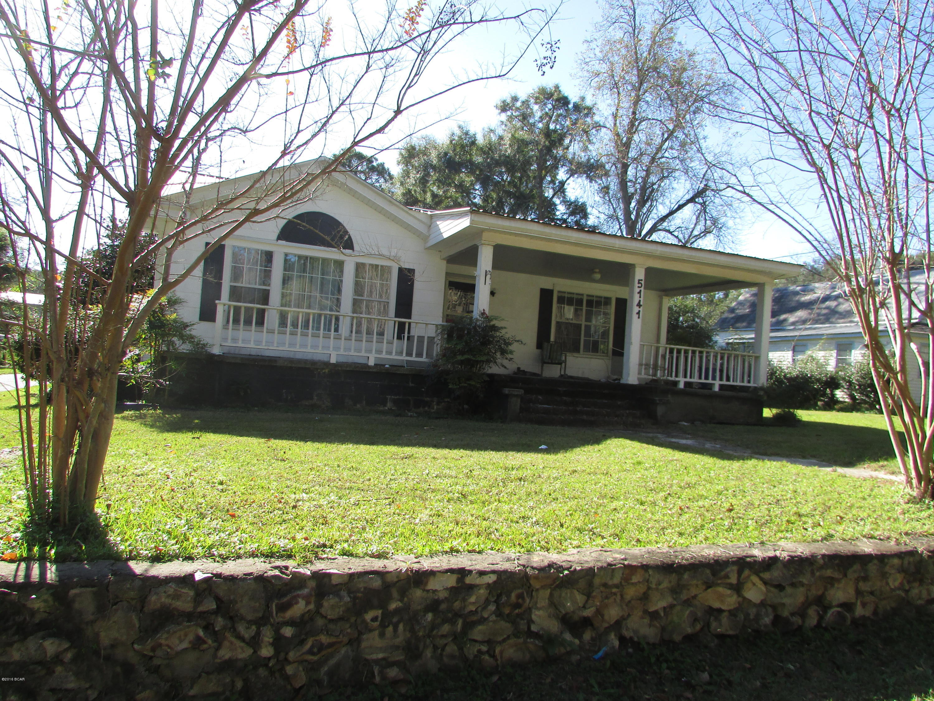 County Home in Greenwood. 4 Bedroom 2 Bath home with 2170 Sq ft located on almost 1 acre close to City Park! Screen Porch, Covered Patio, Storage Building Newer Metal Roof. Hardwood Floors and ceramic tile floors! Fireplace to keep warm during the winter nights. Detached 3 car carport, fenced yard