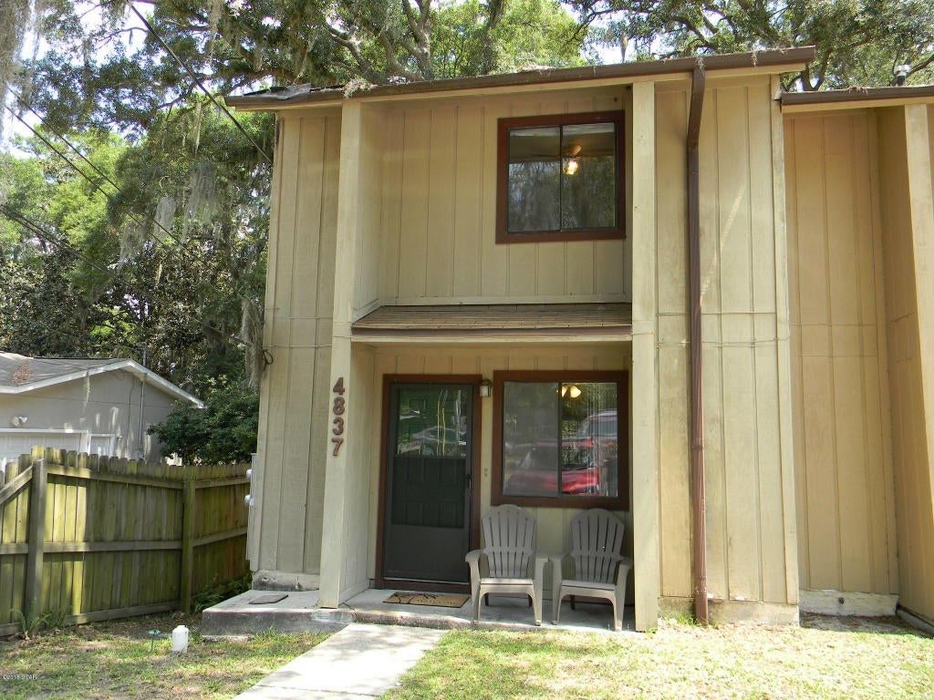 END UNIT TOWNHOUSE ON LAKE MARTIN!  This waterfront townhouse comes furnished and includes the washer and dryer.  You can own this piece of waterfront for cheaper than you can rent it.  The first floor has an open kitchen, dining and living room concept with a 1/2 bath and laundry room.  The upstairs features 2 good size bedrooms and a full bath.  The master bedroom has a walk-in closet and a balcony overlooking the backyard and lake.  Start your day off with scenic waterfront views.  It may be the most relaxing part of your day!  This home also comes with a dock!  New Carpet and Tile in the living room!  Call today to set up your own private preview.  All ages, sizes and measurements approximate; buyer to verify if important.