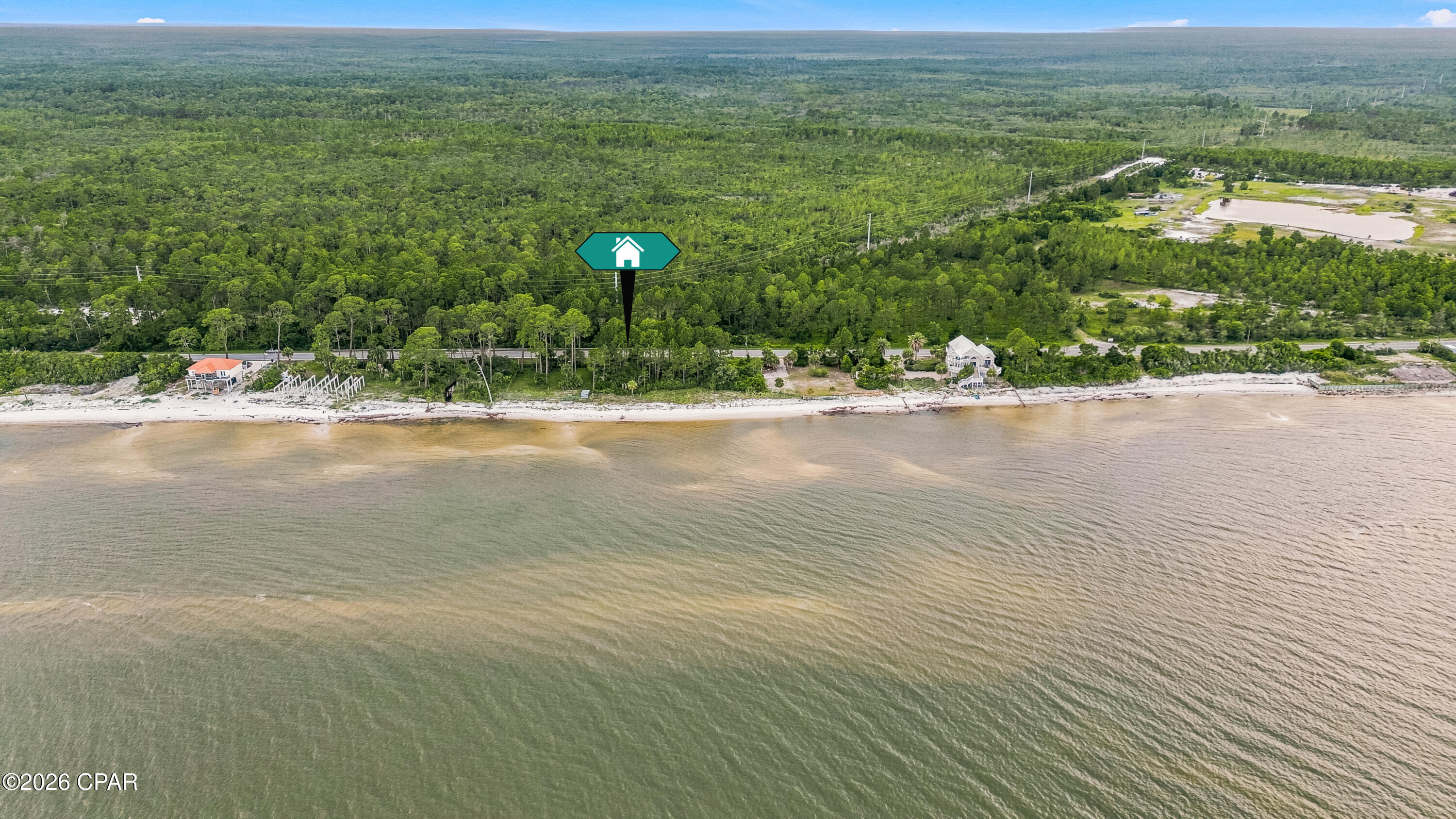 Bayfront vacant land just west of Carrabelle with beautiful frontage on St. George Sound. This coastal parcel offers approx. 100 ft of US-98 frontage and approx. 100 ft of bay frontage, with an estimated size of about 0.28 acres based on survey dimensions. Enjoy wide-open water views, convenient paved road access, and a peaceful setting along Florida's Forgotten Coast. Located between Carrabelle and Eastpoint/Apalachicola, this property offers a rare opportunity to own a bayfront homesite or coastal retreat location. Buyer to verify all information including dimensions, acreage, zoning, buildability, utilities, setbacks, flood zone, permitting requirements, and intended use.