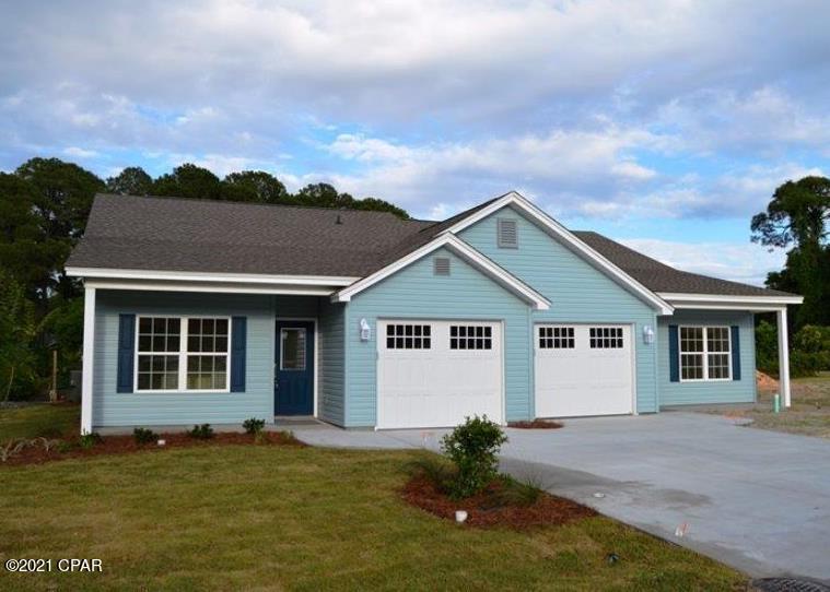 This waterfront duplex stands alone on the western side of Lake Caroline.  Now 11 years old, it was built by one of Bay County's premier homebuilders, Koehnemann Construction.  Sound-proof features, 1,335 SF living area, 257 SF garage, & large attic storage.  Split bedroom design with large master bedroom overlooking the lake, walk-in closet, & spacious walk-in shower.  Ceramic tile floors in kitchen, baths & laundry.  High elevation, 16' above sea level, no storm damage.  Close proximity to St. Andrews, Lisenby Walking Park, Al Helms Dog Park, & Panama City Garden Club and walking track.  Only 4 blocks from Beach Drive with public access to watch the sunset and a view of Shell Island and the State Park.  Small pets will be considered with additional non-refundable pet deposit. **No Smoking**
