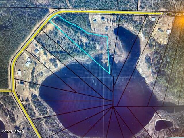 RARE lakefront opportunity! Escape to peaceful country living on 5.17 acres in Chipley, nestled within a gated community with paved roads. Build your dream home with minimal restrictions and enjoy the best of waterfront living. Spend your days swimming, boating, fishing, kayaking, paddleboarding, or simply relaxing by the lake. 

Conveniently located just 35 minutes north of Panama City Beach in the tranquil Greenhead area just off highway 77, this property is ideal for a weekend retreat or a full-time residence. Nature lovers will appreciate being just minutes from Pitts Spring, Williford Spring and Cypress Spring where you can enjoy crystal-clear natural springs and canoeing along Econfina and Holmes Creek. Experience breathtaking natural beauty and the peaceful lifestyle you've been searching for.