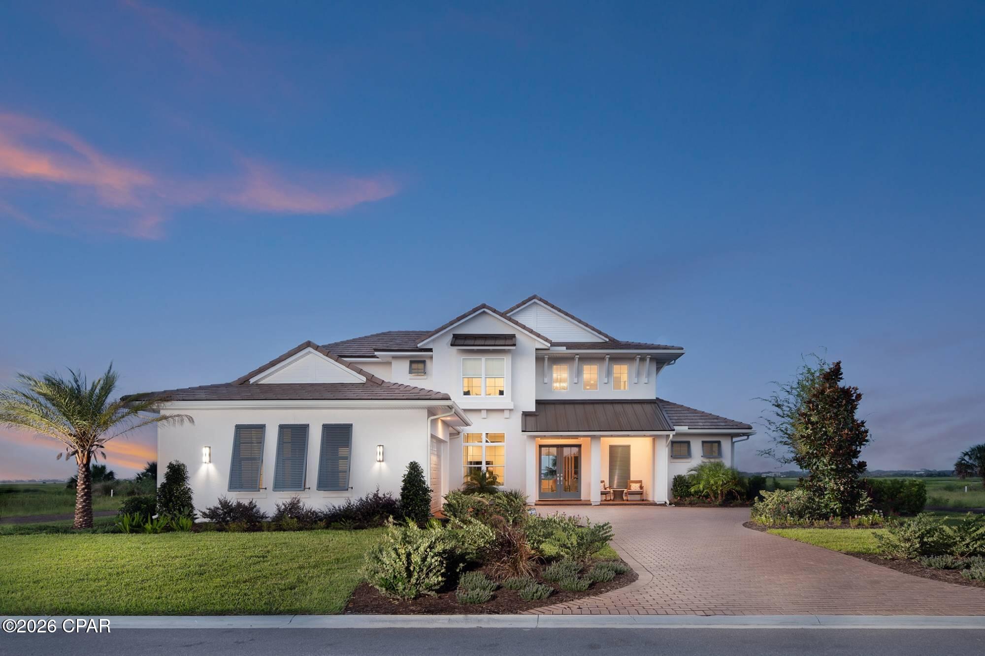 To be built the Solera, with AR Homes, a thoughtfully designed luxury residence offering over 4,300 square feet of refined living space, perfectly suited for a premier waterfront homesite. This two-story plan features 4 bedrooms, 4 full baths, a powder room, and a 3-car garage, blending elegant architecture with modern functionality.

The main level is designed for both everyday living and entertaining, highlighted by a grand two-story foyer and a light-filled great room with soaring ceilings and expansive walls of glass that seamlessly connect indoor and outdoor living. The open-concept kitchen and dining area flow effortlessly to a spacious lanai, creating the ideal setting to capture water views and coastal breezes.

A private owner's suite on the first floor offers a true retreat, complete with a spa-inspired bath and a secluded wing for added privacy. Additional main-level features include a den or office and a versatile bonus room, perfect for a media space or entertaining lounge.

Upstairs, a generous loft with optional wet bar and access to a covered balcony provides an elevated gathering space overlooking the main living areas. Three additional bedrooms each offer comfort and privacy for family or guests.

Designed with waterfront living in mind, the Solera's expansive outdoor living areas can be customized to include a pool, outdoor kitchen, and cabana, creating a seamless extension of the home's luxurious interior.

This is a rare opportunity to build a fully customized coastal dream home, combining sophisticated design, flexible spaces, and exceptional indoor-outdoor living in a prime waterfront setting.

-No fill dirt, clearing, additional foundation or lot preparation is included. It's an additional expense. 
Pool/outdoor living and outdoor kitchen are optional, and they're not included in the base price. 
The sale of the lot is a separate transaction.
