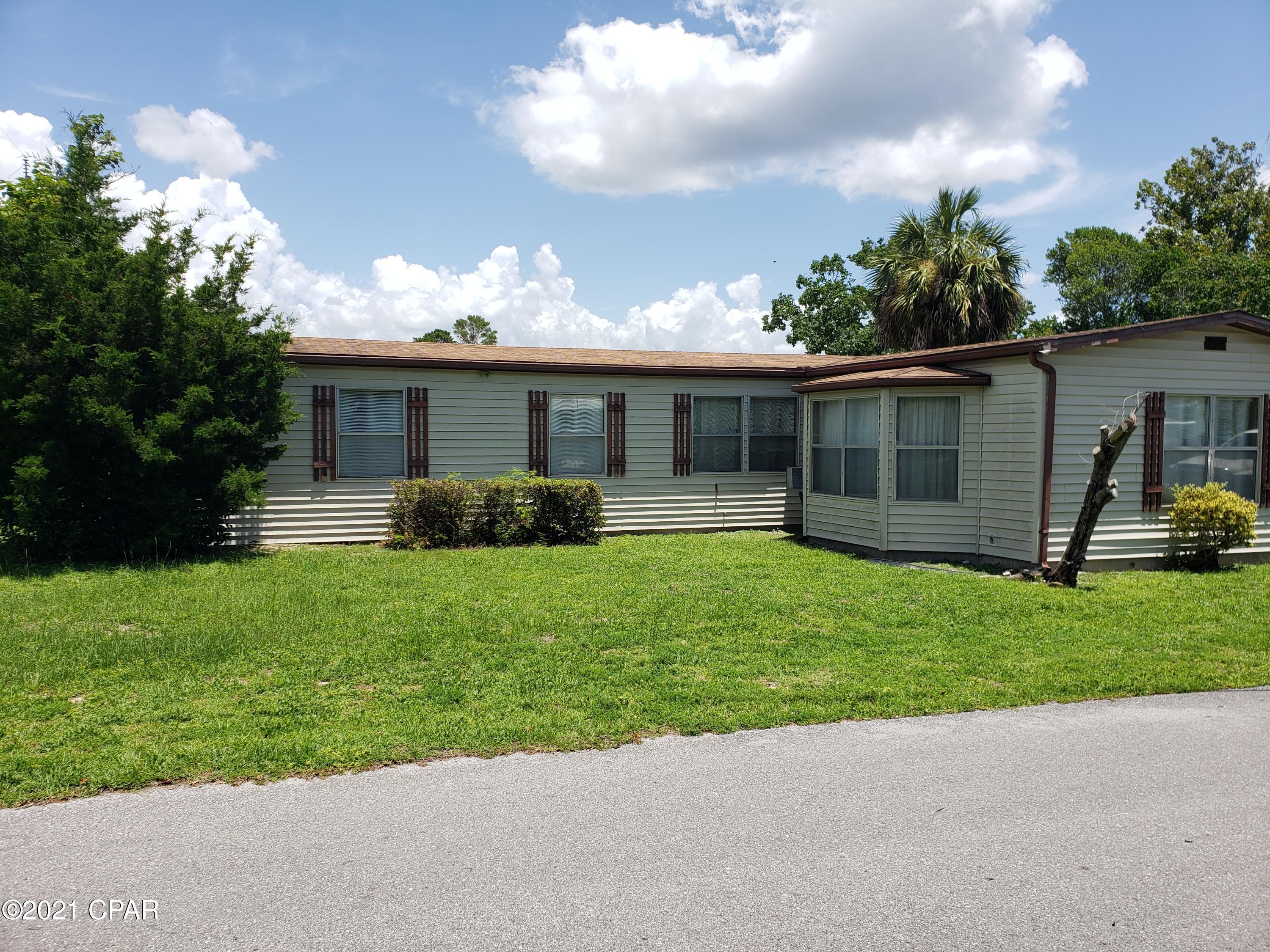 Great location near Panama City Beach.  Just a short walk to the beaches.  What an opportunity.  This home has water damage in the kitchen and along the north side.  That is why it is price so well.  The home has a construction addition (family room), and a detached carport.  The property need some repair but would make a great home afterwards.  The sellers said they are leaving everything so you have a furnished home.