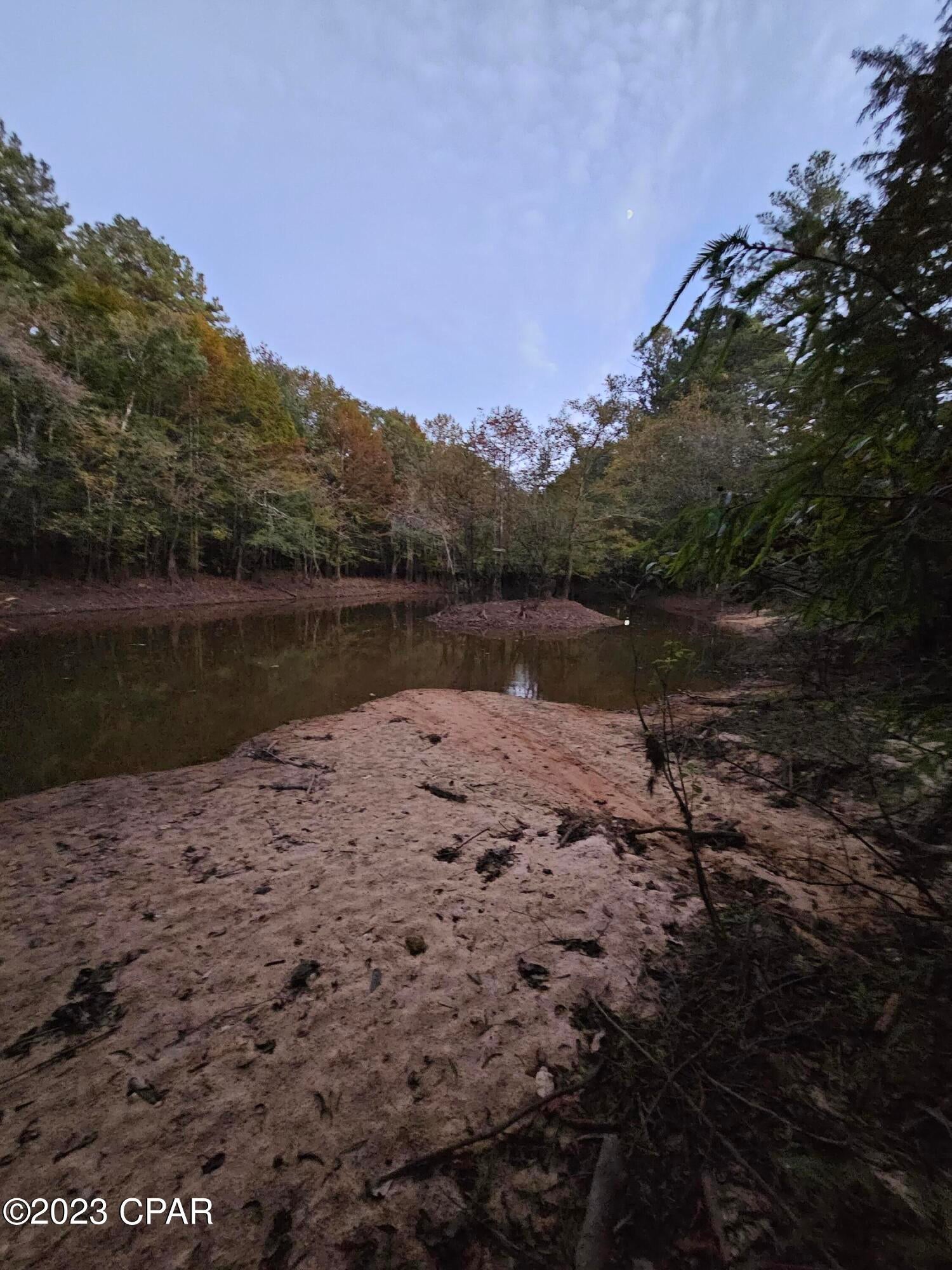 HOLMES CREEK ACCESS!! SELLER WILL CONSIDER ALL OFFERS! This parcel is divided, with the larger portion on one side of the road and the Holmes Creek portion (triangle) on the other side across the street (see pics). Property is wetlands, but with some fill, you can add your country home, pole barn, MH or camper on the bigger part and on the other, hop into your kayak or canoe and head down to the main part of Holmes Creek for some relaxing days of leisure! Approximately 160' of frontage facing the creek. Washington Cty confirmed 1 home or MH can be put on the property. SELLER SAYS: BRING YOUR OFFERS! All will be considered.