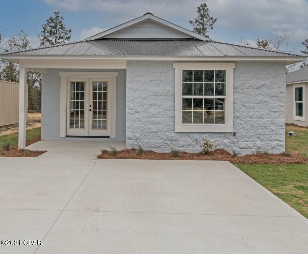 Brand New Home! Concrete block construction with metal roof, open concept living area, and covered front porch. Low Maintenance and stylish concrete floors, new stainless appliances, Formica countertops, breakfast bar and vaulted ceiling in living area. Features new septic, concrete driveway, well water, secondary roof water barrier, low-E windows, 17 Seer HVAC System. No HOA. Quiet area North of Panama City near Hwy 231 and Hwy 20. 30 Minutes to Panama City, 40 Minutes to Panama City Beach. Pictures shown are of same construction but different floorplan. Exact colors and materials may differ. Buyer to verify all details. Design and color choices available.