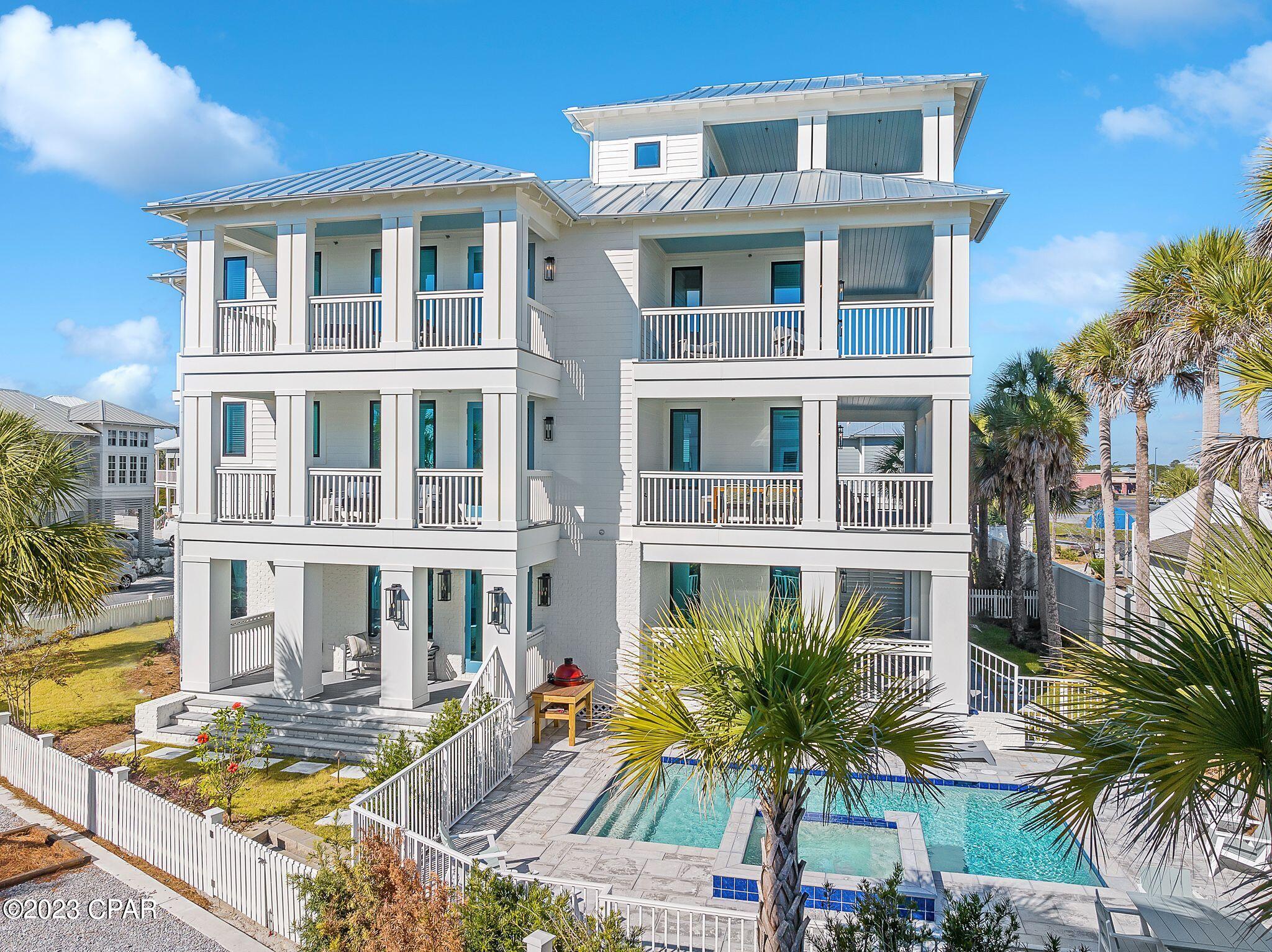 New decor updates and furniture, This Exceptional New Construction Luxury Home is one of a kind and must be the first on your list with 6969 total sq. ft. and 4058 of conditioned air, 2 car garage, 8 exterior decks, 5 Bedrooms, 5 full baths and 2 1/2 baths, 4 wet bars with a PRIVATE POOL and SPA.  The house features a Rec Room and 1 bedroom on the first floor with entry to the pool and two different decks, Kitchen/Dining on the second level with an open living area & 2 more bedrooms with baths and as well entry to two different decks.   The third floor has a large bunk room and bath on the front along with a master suite that has endless views of the Gulf along with a private balcony overlooking the pool with fantastic views of the gulf, a bunk room with another deck with Gulf views and a spiral staircase that takes you to the 4th floor open deck and wet bar area along with a 1/2 bath and endless Gulf views both East and West.  Designed with plenty of Room to sleep up to 20 and as well plenty of Decks for Entertaining space with fantastic Private Sunsets views  All this and its featured on a corner oversize lot, plenty of parking space in driveway, garage and roadside and just right off the gulf with easy access to the gulf just a few footsteps away on Private Carillon Beach, a quiet and serene gated community with approximately 3900 linear feet of sugar white sand and emerald waters. Amenities include three community pools (one beach front) tennis courts, basketball court and children's playground area, eateries and shops. You are a 5-minute bike ride from upscale shopping and restaurants in Rosemary Beach and 30 Avenue. Call today for your preview of this amazing home! Home sold fully furnished.