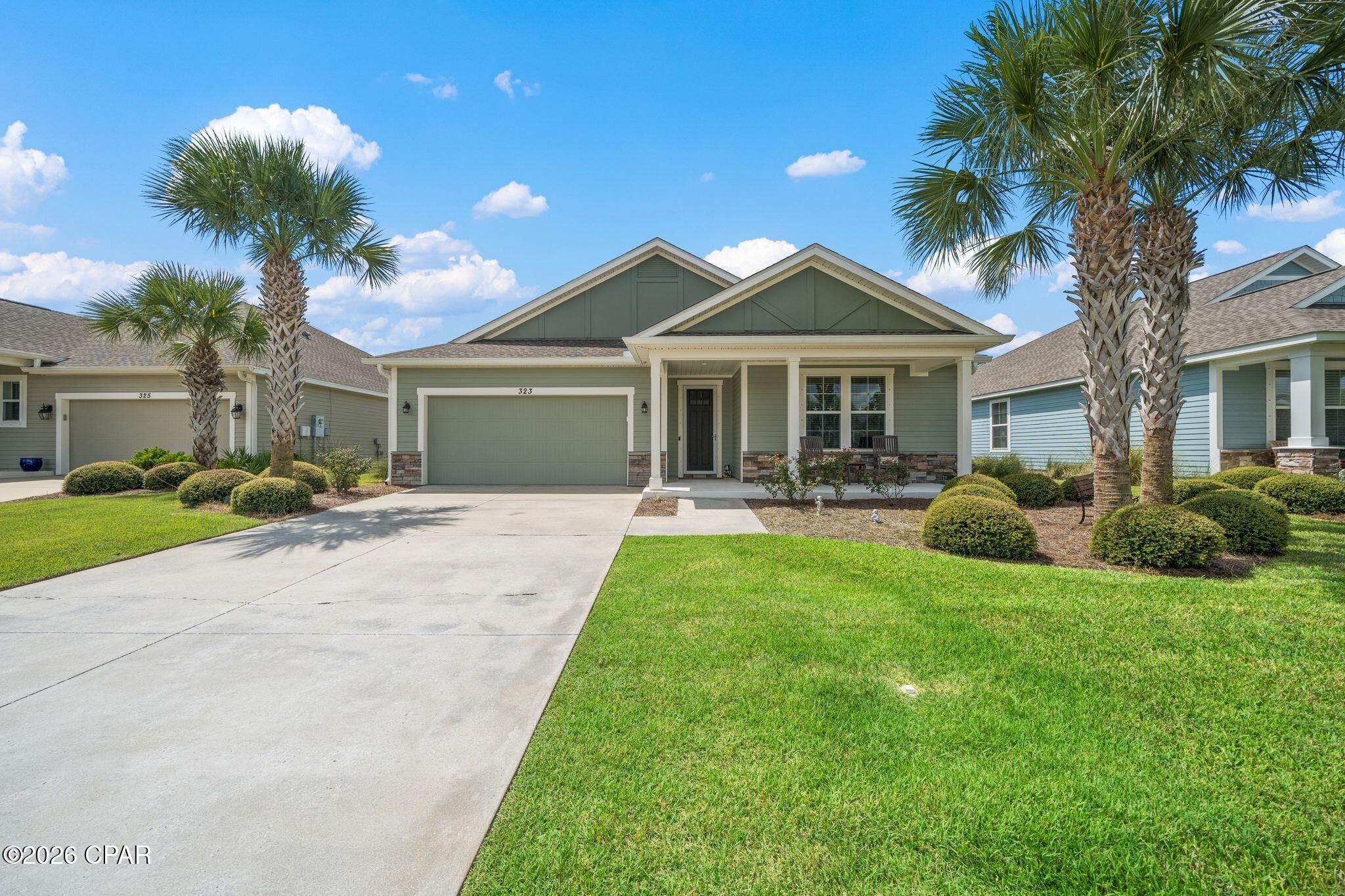 Welcome to Whisper Dunes - located just a half mile from the World's Most Beautiful Beaches! Experience coastal living in this low maintenance 3 BR/2 BA immaculate home.  Inside, the open floor plan offers hardwood floors, 8 foot doors with craftsman style trim, lots of natural light from the oversized windows.  The primary suite features a trey ceiling, ensuite bath with walk in shower, tub, double vanities and a large walk-in closet.  Two additional guest bedrooms with a full bath provides flexibility for guests, home office or family living. You will love the kitchen/dining area with all new stainless steel appliances, granite countertops, under-cabinet lighting and plenty of beautiful cabintry offering lots of storage. Enjoy the beautiful backyard with screened in porch, firepit and pergola - plenty of room outdoors for privacy and entertaining.  The 2 car garage offers epoxy coated flooring for a clear durable finish. Whisper dunes is a well-kept, deed restricted community offering a large community pool, cabana, walking paths, and full lawn maintenance included in the HOA dues. Located close to Pier Park, ECP Airport, fine and casual dining,  Scenic Hwy 30A, Camp Helen State Park, and more! All data and dimensions to be verified by buyer.