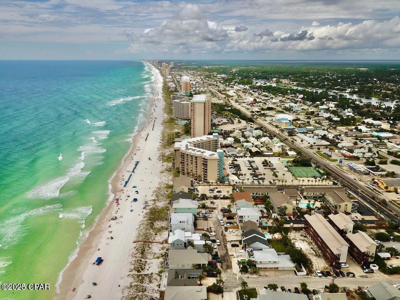 Huge Price Reduction ** seller motivated** bring all offers ..... Affordable Beach Retreat - Rare Find 1BD loft UNIT ..... Just 100 Yards from the Gulf! Don't miss your chance to own one of the most affordable beach condos on the Emerald Coast! Perfect as a personal getaway or an income-producing investment, this top-floor gem is ideally located just steps from Beach Accesses 13 & 14--putting the sugar-white sands of the Gulf right at your doorstep. Inside, you'll find a beautifully updated, fully furnished space ready to enjoy from day one. The main level features an open-concept living area with a sleek modern kitchen (stainless steel appliances + granite countertops), dining space, comfortable living room, and a full bathroom. Upstairs, a spacious loft bedroom with king-size bed, mounted TV, and private half bath creates a relaxing retreat. Extra perks include: Washer/dryer + storage space right outside the door for your beach gear. Peek-a-boo Gulf views from your windows. Private front deck for enjoying coastal breezes. Lightly used & well-maintained. Community amenities make this condo even more attractive: a gated pool, reserved parking, and an unbeatable east-end location close to restaurants, shops, and entertainment along Thomas Drive. Whether you're looking for a low-maintenance beach escape or an affordable short-term rental with excellent potential, this property is a standout opportunity. Act now--condos this close to the beach at this price point rarely last. Schedule your private showing today, ask your questions, and be ready to make an offer before it's gone!